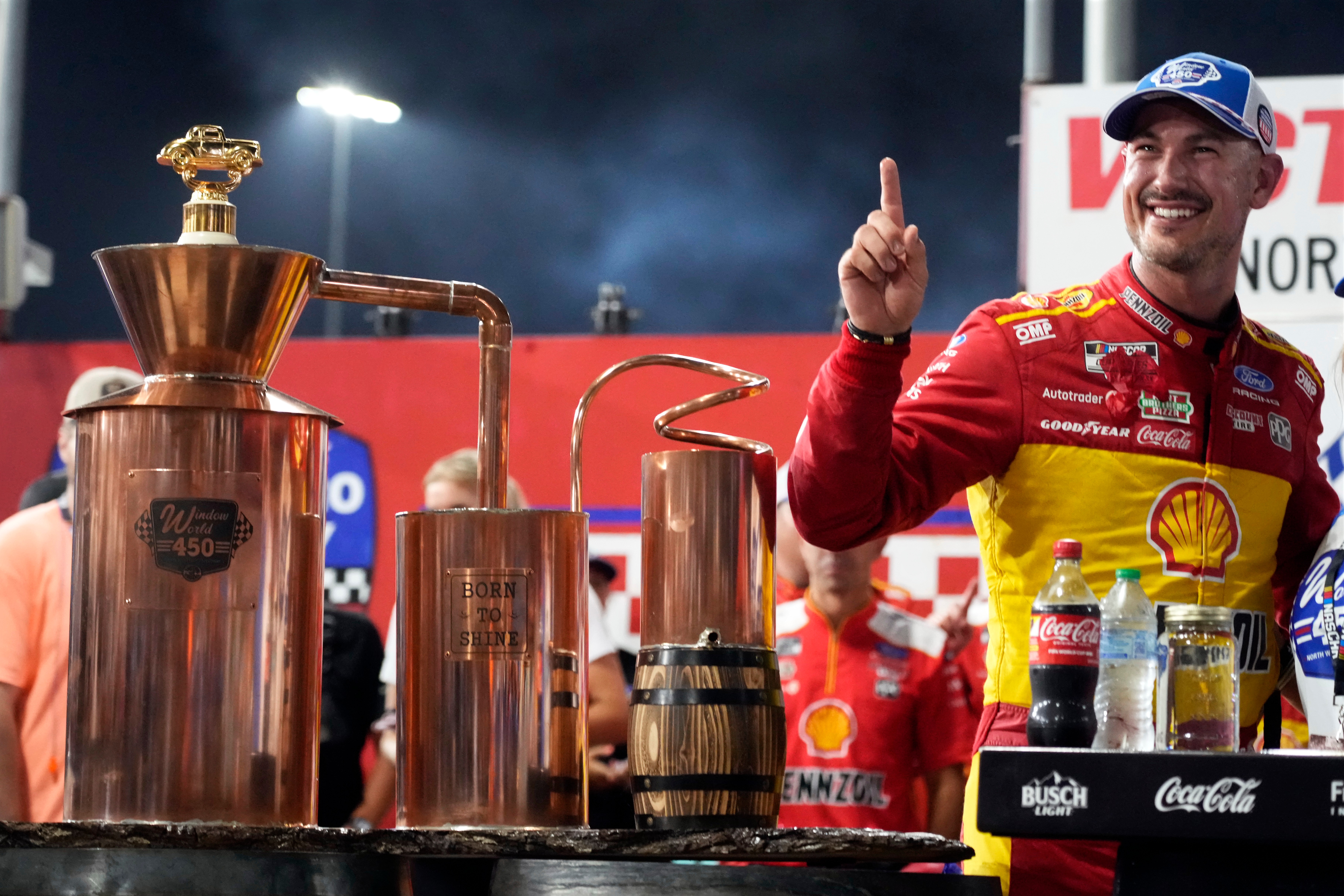 Joey Logano poses with the trophy in Victory Lane after winning a NASCAR Cup Series auto race in North Wilkesboro, N.C., Sunday, July 19, 2026.