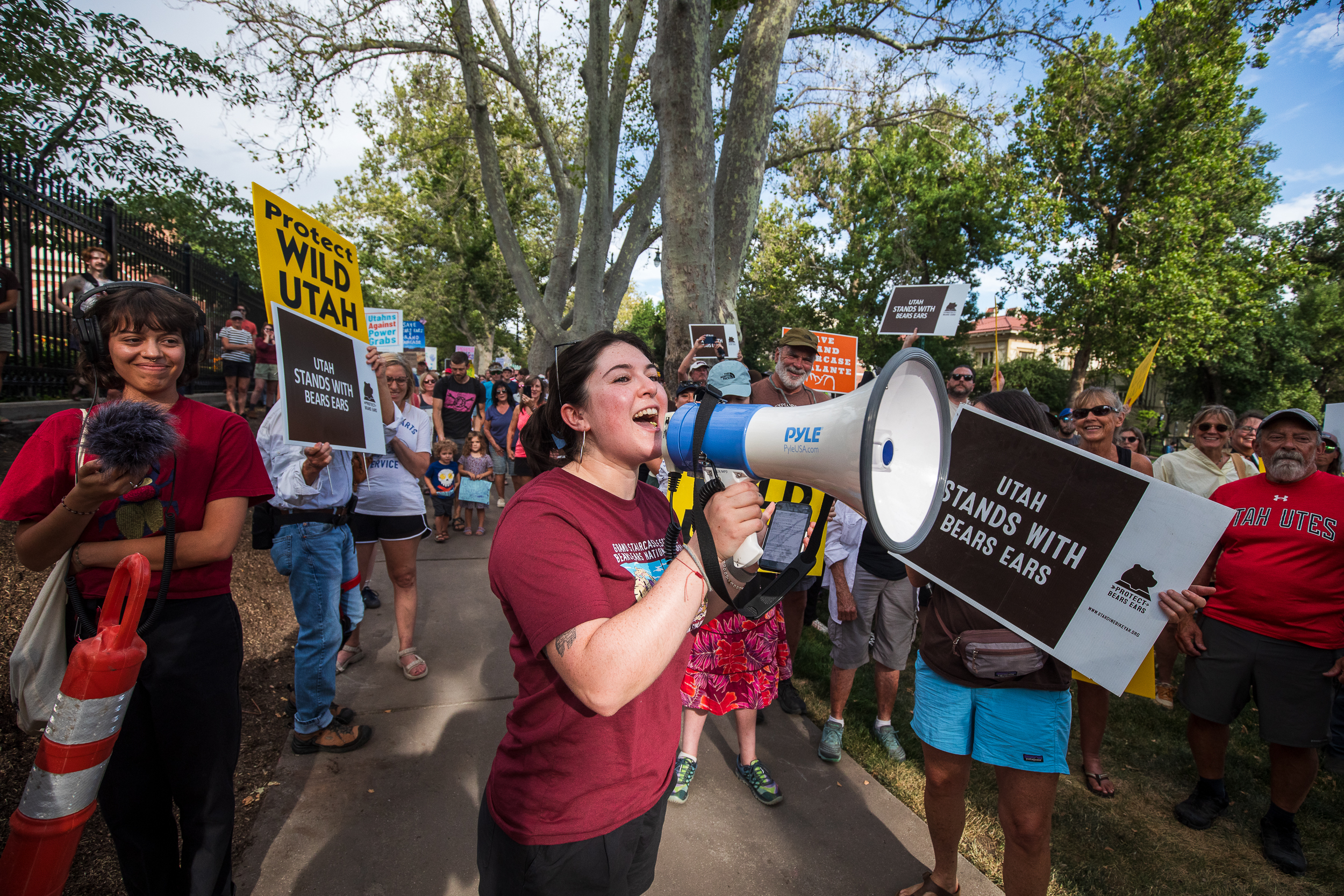 Mimi Ortega, Utah organizer for the Southern Utah Wilderness Alliance, leads a chant during a protest about the reduction of Bears Ears and Grand Staircase-Escalante national monuments outside of the Utah Governor's Mansion in Salt Lake City on Monday.