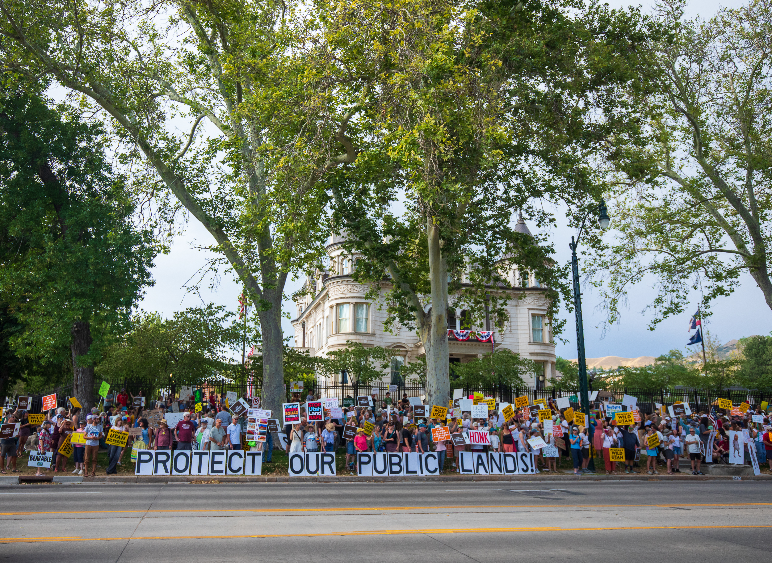 People protest the reduction of Bears Ears and Grand Staircase-Escalante national monuments outside of the Utah Governor's Mansion in Salt Lake City on Monday.