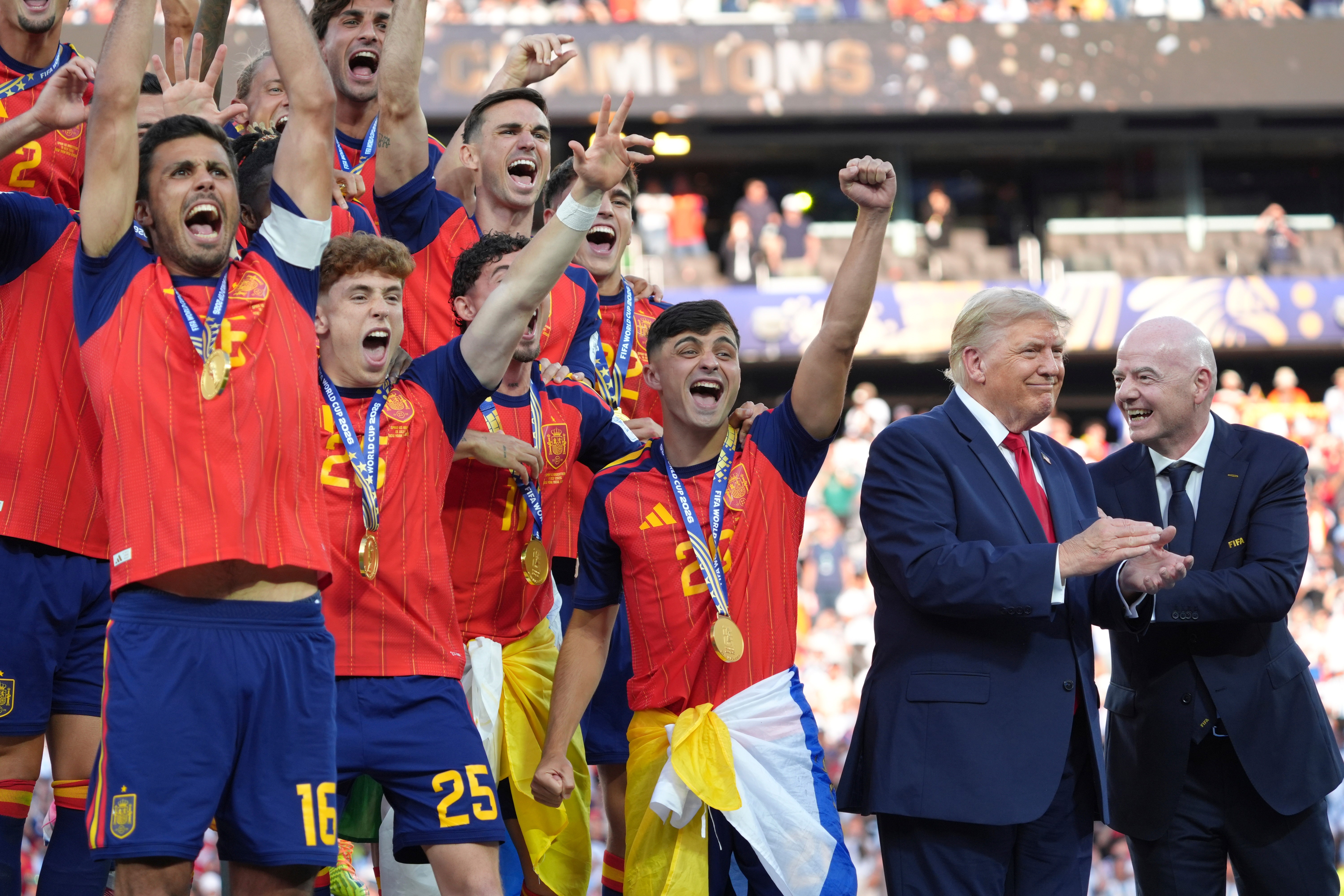 Spain players, from left, cheer alongside President Donald Trump and FIFA President Gianni Infantino at the conclusion of the World Cup championship final soccer match between Spain and Argentina in East Rutherford, N.J., Sunday, July 19, 2026.