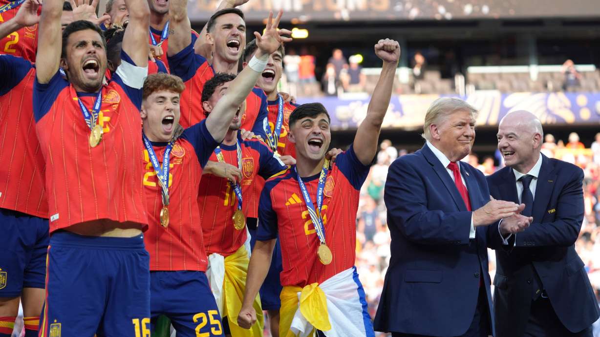Spain players, from left, cheer alongside President Donald Trump and FIFA President Gianni Infantino at the conclusion of the World Cup championship final soccer match between Spain and Argentina in East Rutherford, N.J., Sunday, July 19, 2026.
