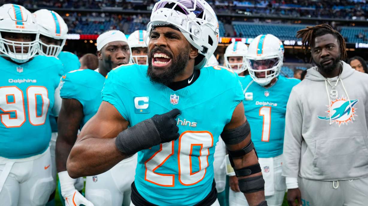 FILE - Miami Dolphins linebacker Jordyn Brooks (20) reacts as he warms-up before an NFL football game between the Washington Commanders and the Miami Dolphins in Madrid, Spain, Nov. 16, 2025.
