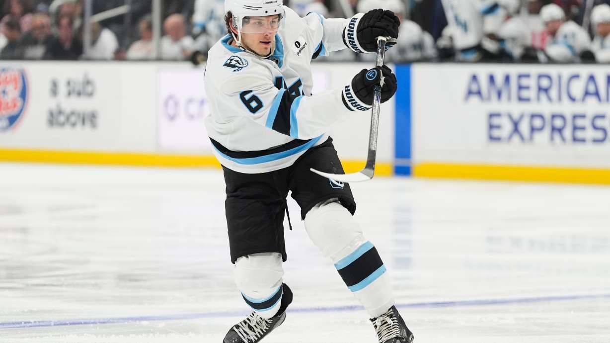 FILE - Utah Mammoth defenseman John Marino (6) hits the puck during the third period of an NHL hockey game against the Los Angeles Kings, March 28, 2026, in Los Angeles.