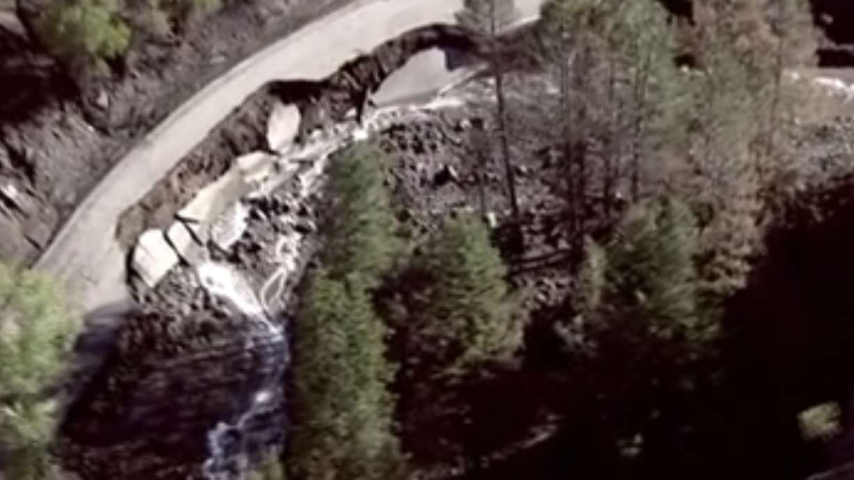 A segment of state Route 153 is seen washed out next to the Beaver River on Monday. Utah Department of Transportation officials said Tuesday that the highway through Beaver Canyon is closed indefinitely because of damage.