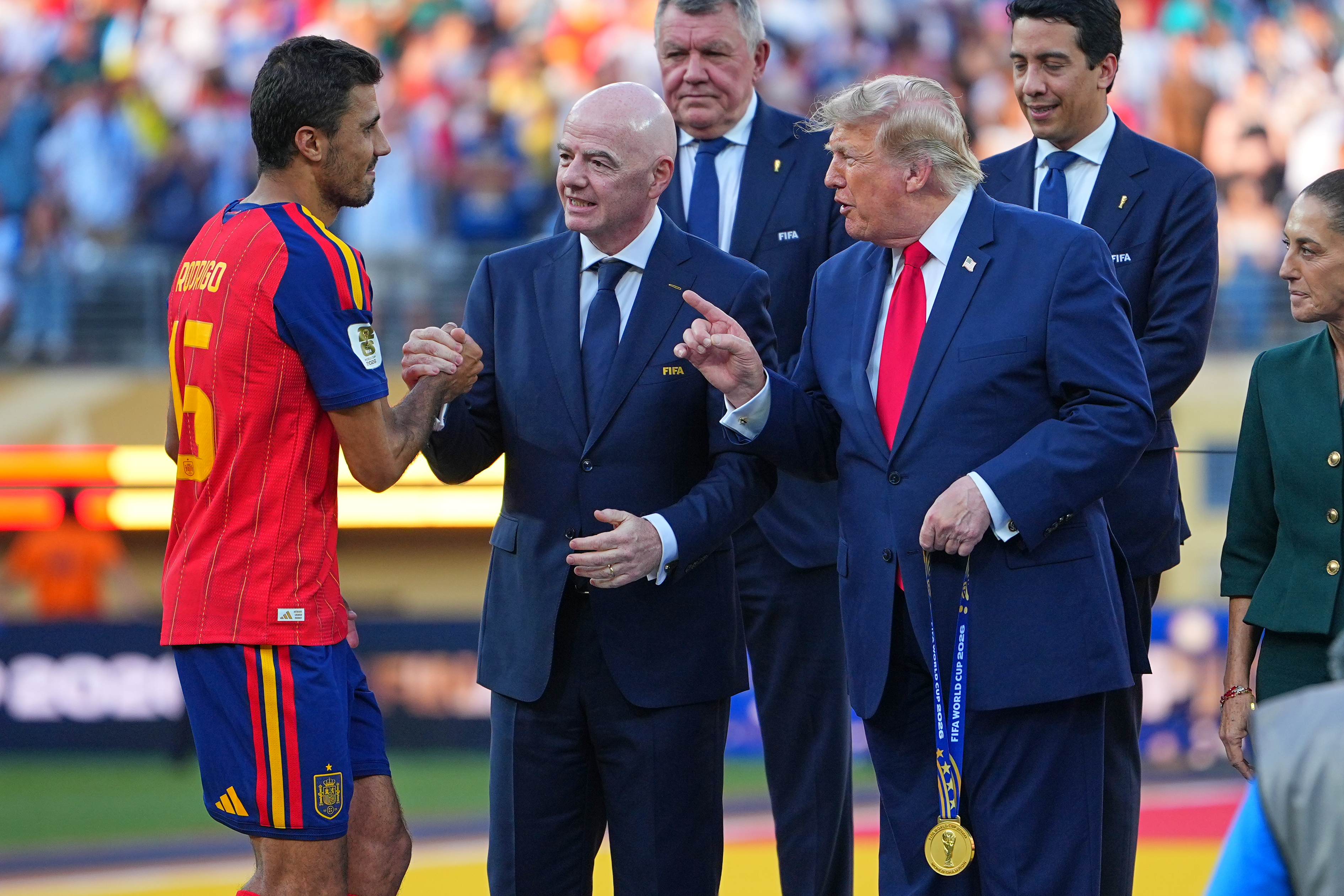 Spain's Rodri (16) is greeted by FIFA President Gianni Infantino and President Donald J. Trump during the presentation ceremony after the World Cup final soccer match between Spain and Argentina in East Rutherford, N.J., near New York, Sunday, July 19, 2026. 