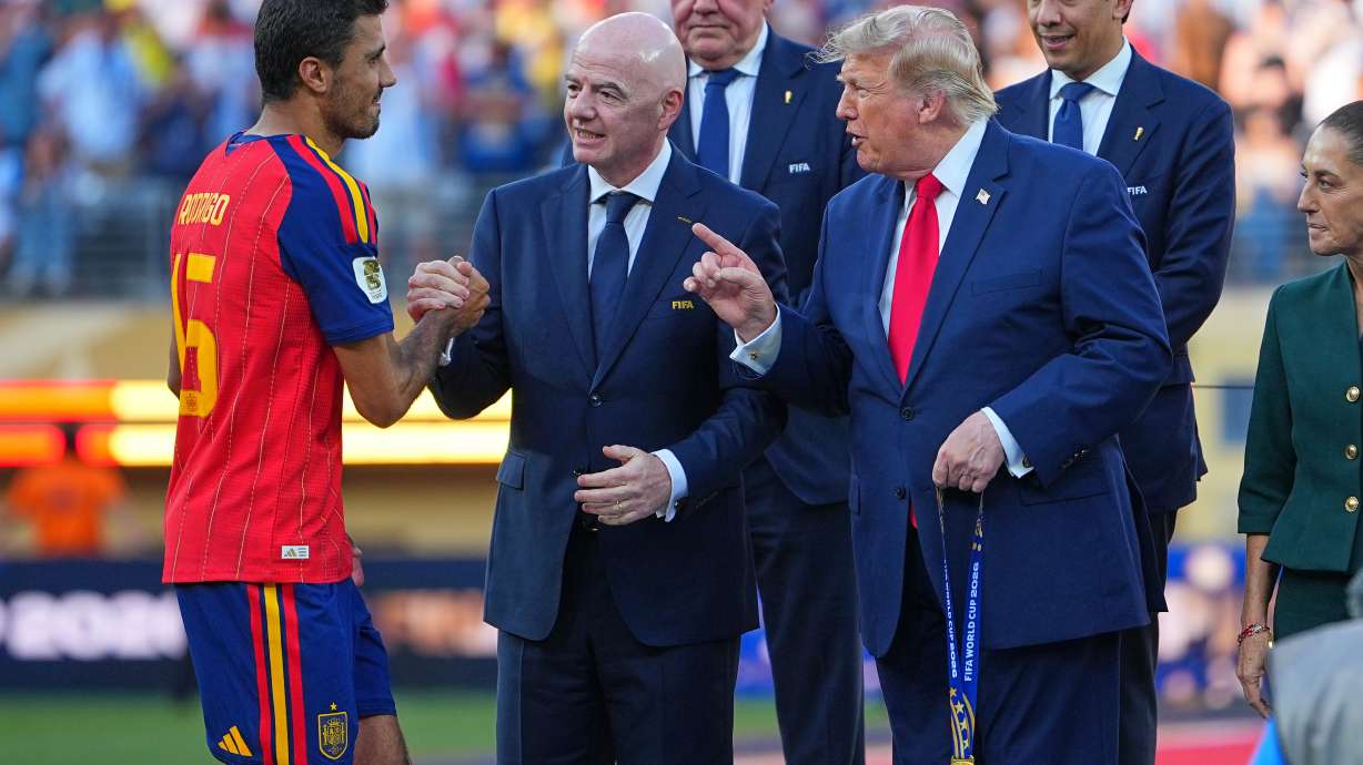 Spain's Rodri (16) is greeted by FIFA President Gianni Infantino and President Donald J. Trump during the presentation ceremony after the World Cup final soccer match between Spain and Argentina in East Rutherford, N.J., near New York, Sunday, July 19, 2026.