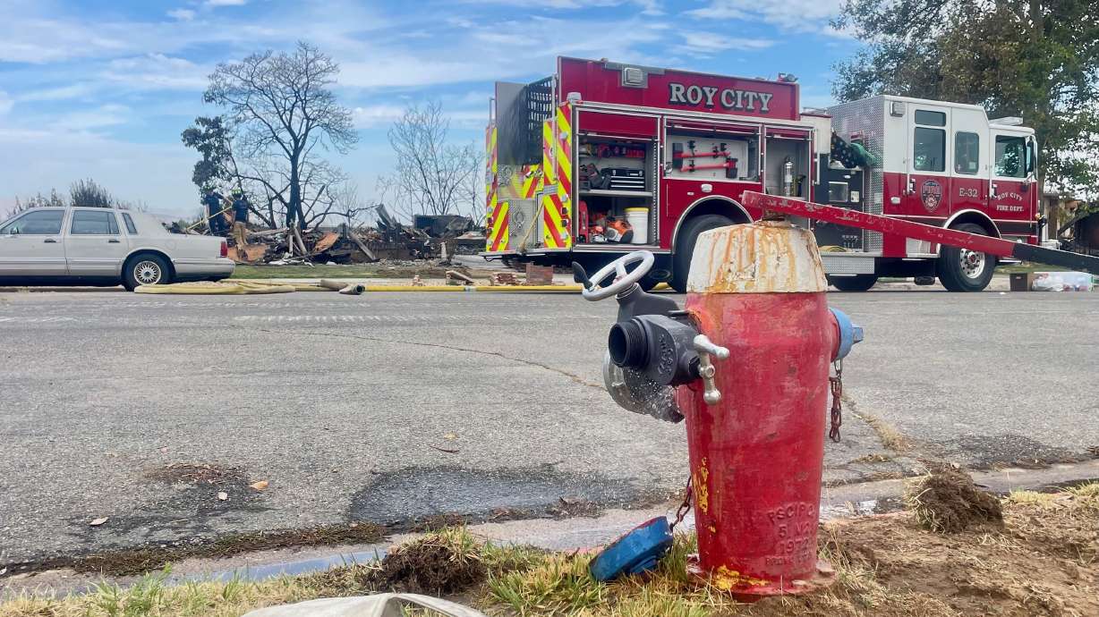 A day after the fire on Monday along a rail corridor shared by Utah Transit Authority and Union Pacific that torched three homes, debate lingers over the cause. One of the most impacted homes, across the street in the photo, is pictured on Tuesday.