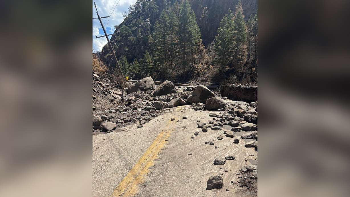 Boulders and mud cover a section of state Route 153 in Beaver Canyon. Utah Department of Transportation officials said Tuesday that the canyon route is closed indefinitely because of flood damage.