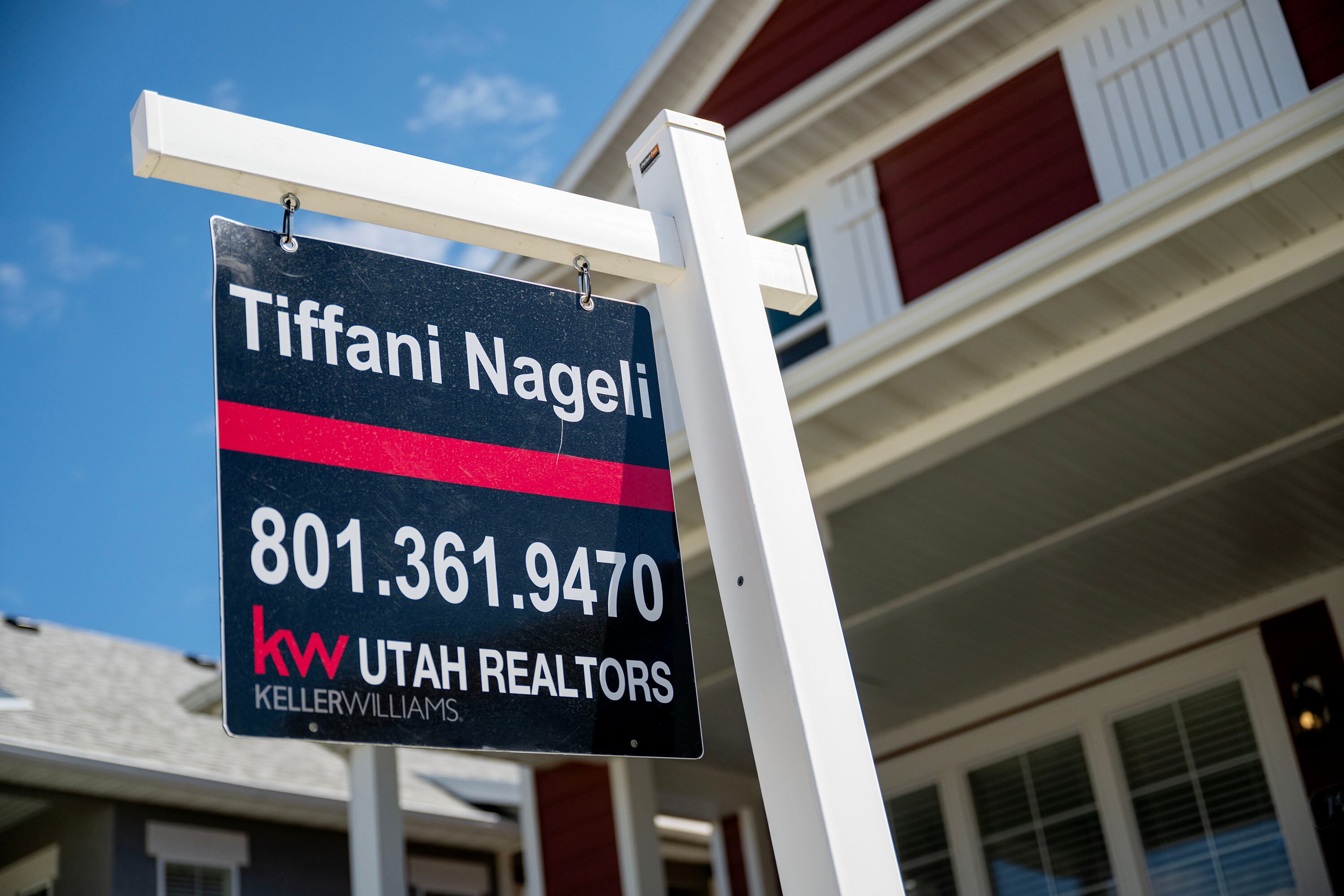 A for-sale sign stands in front of a home in West Jordan on May 12. A new analysis found mortgage rates must fall below 3% for Utahns to even afford a home.