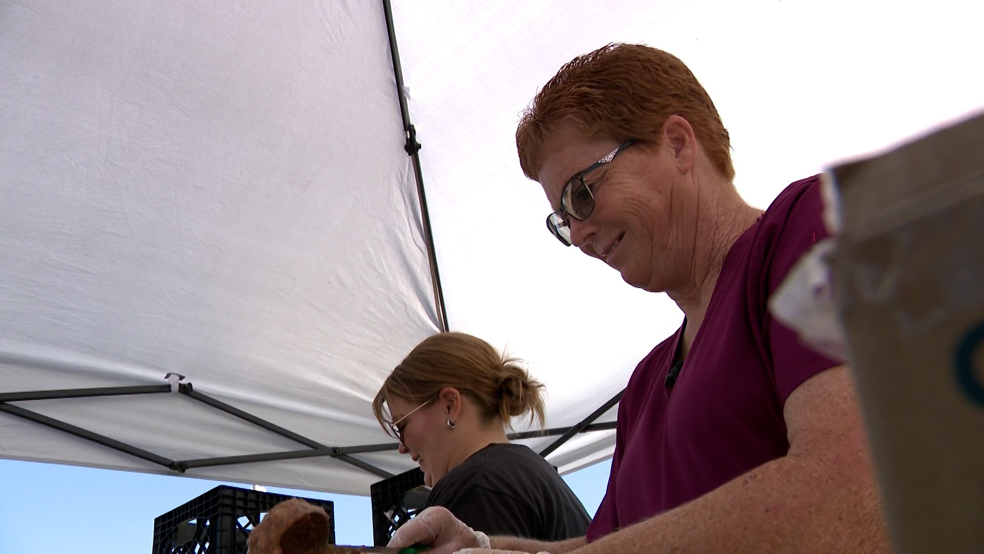 School employees in Beaver pass out meals on Tuesday.
