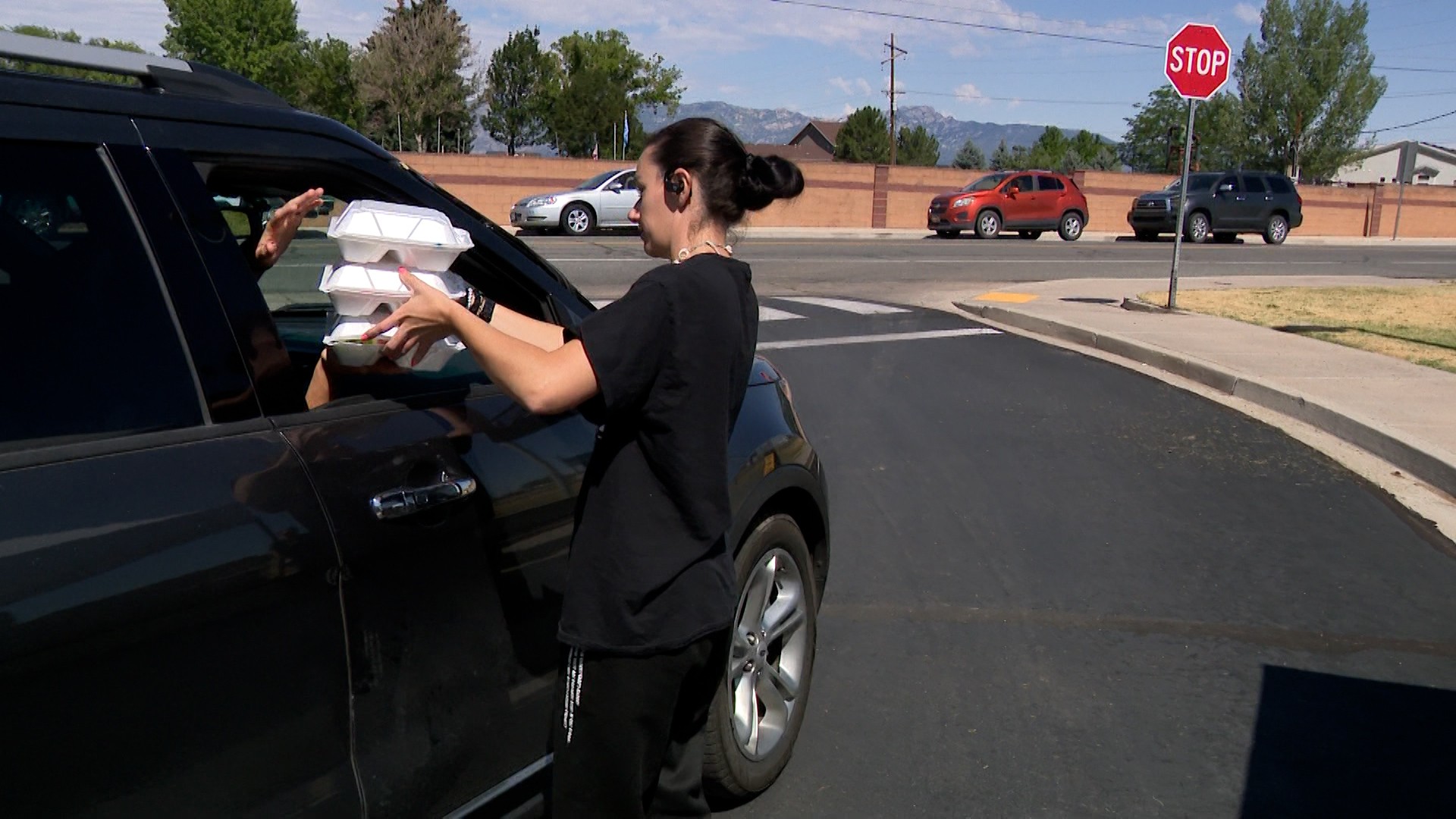 School employees in Beaver pass out meals on Tuesday.