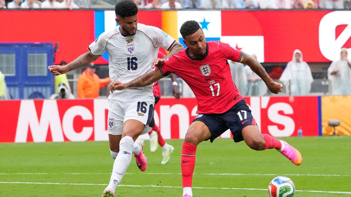 England's Morgan Rogers (17) and Panama's Andres Andrade (16) battle for the ball during the World Cup Group L soccer match between Panama and England in East Rutherford, N.J., near New York, Saturday, June 27, 2026.