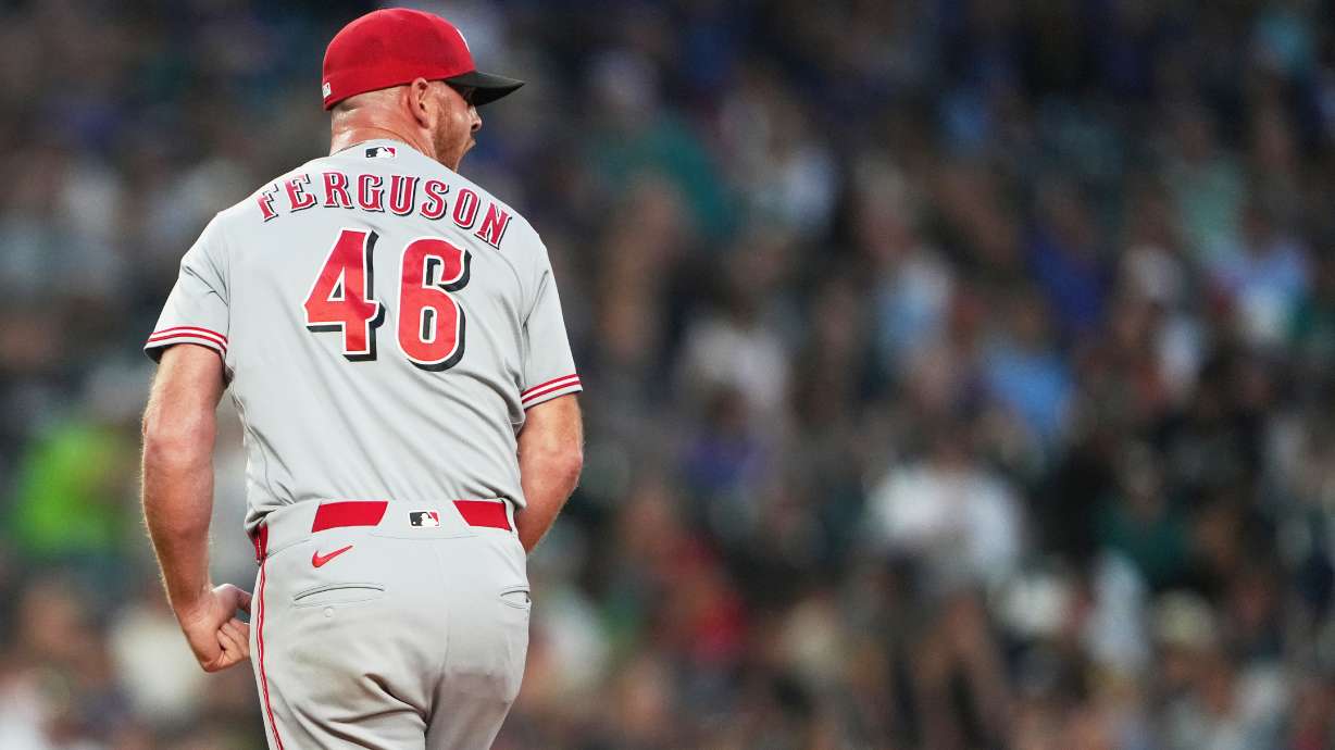 Cincinnati Reds relief pitcher Caleb Ferguson reacts in the seventh inning of a baseball game against the Seattle Mariners, Monday, July 20, 2026, in Seattle.