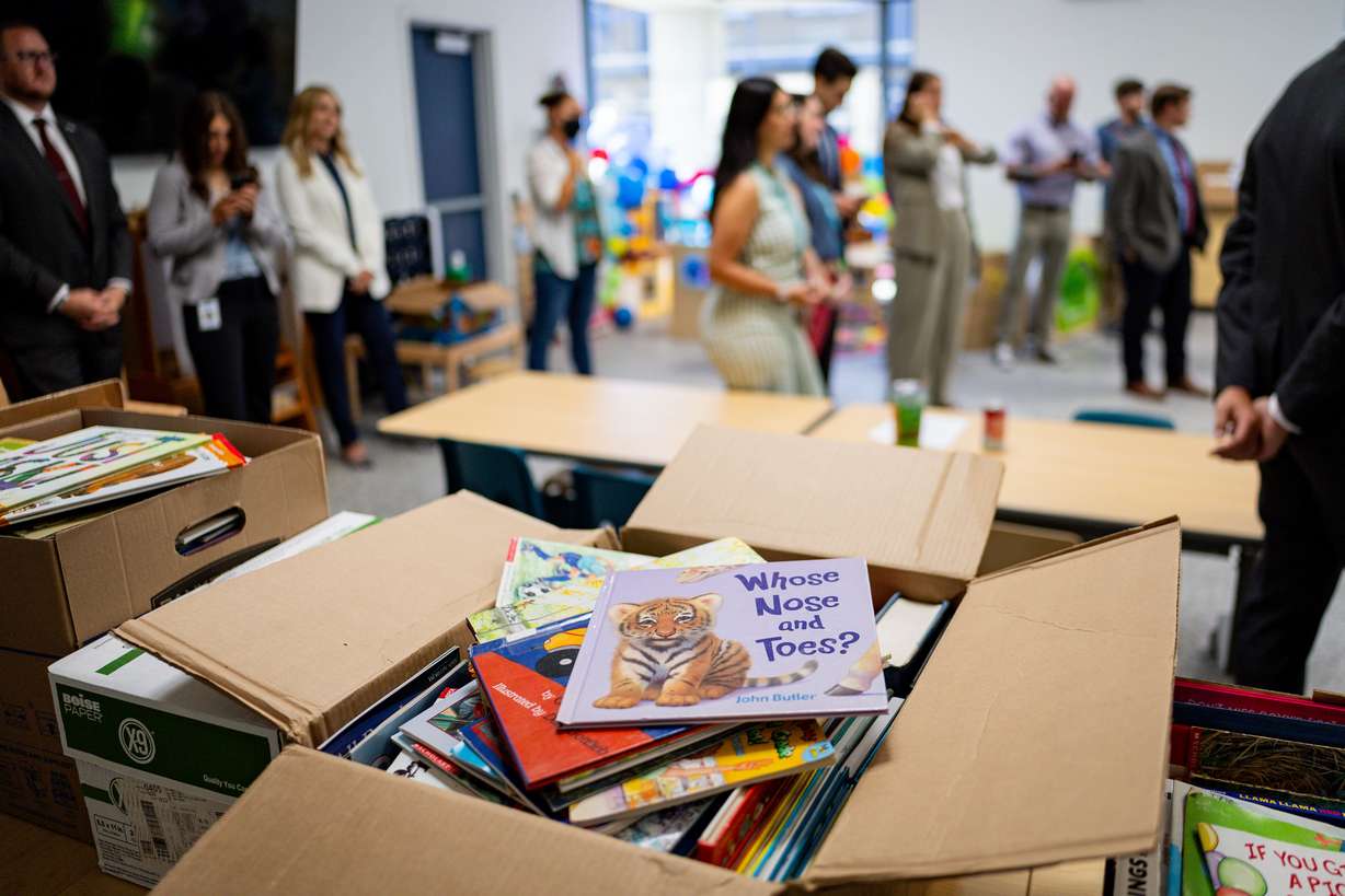 Books remain out after first lady Abby Cox read to children and promoted early literacy at The FINCH (Family Interim Noncongregate Housing), operated by The Road Home, in South Salt Lake on Tuesday.