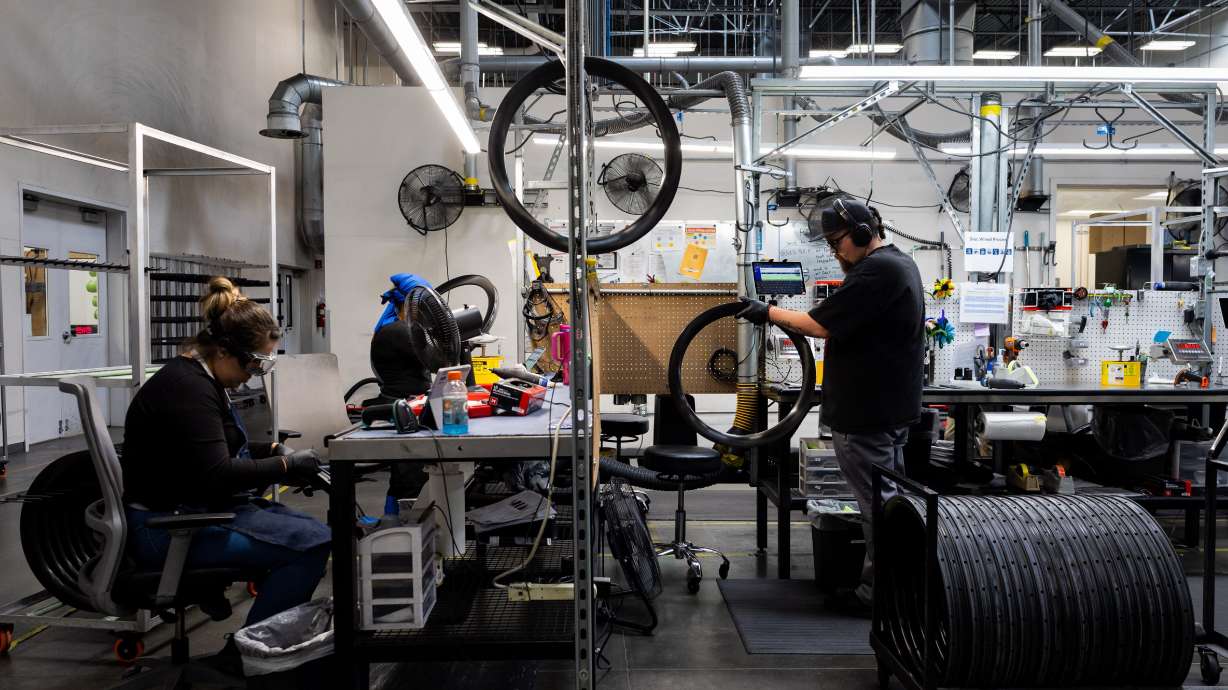 Employees work on quality control at the ENVE Composites factory in Ogden on July 17.