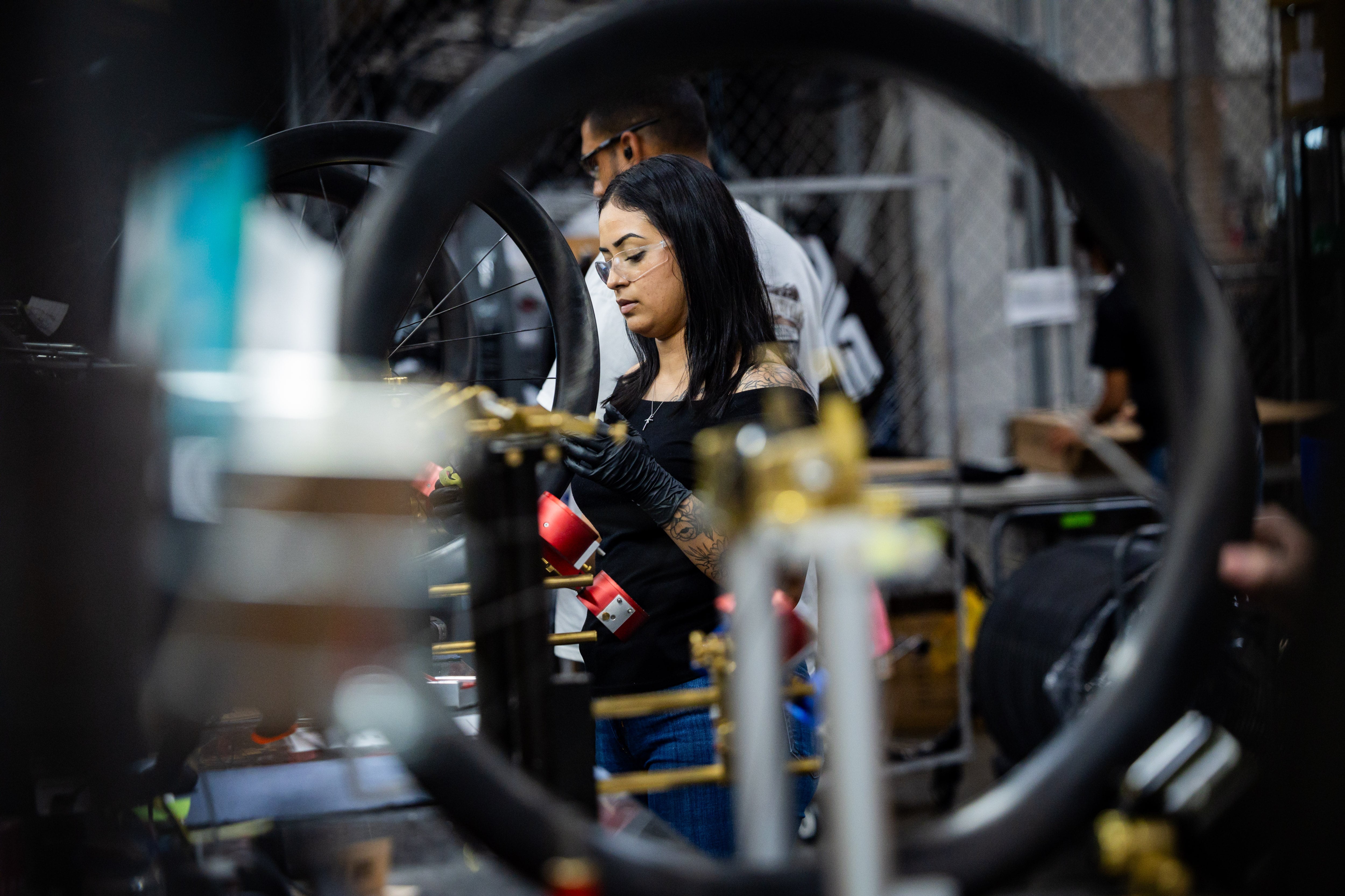 Roxana Barboza works on the wheel build at the ENVE Composites factory in Ogden on July 17.