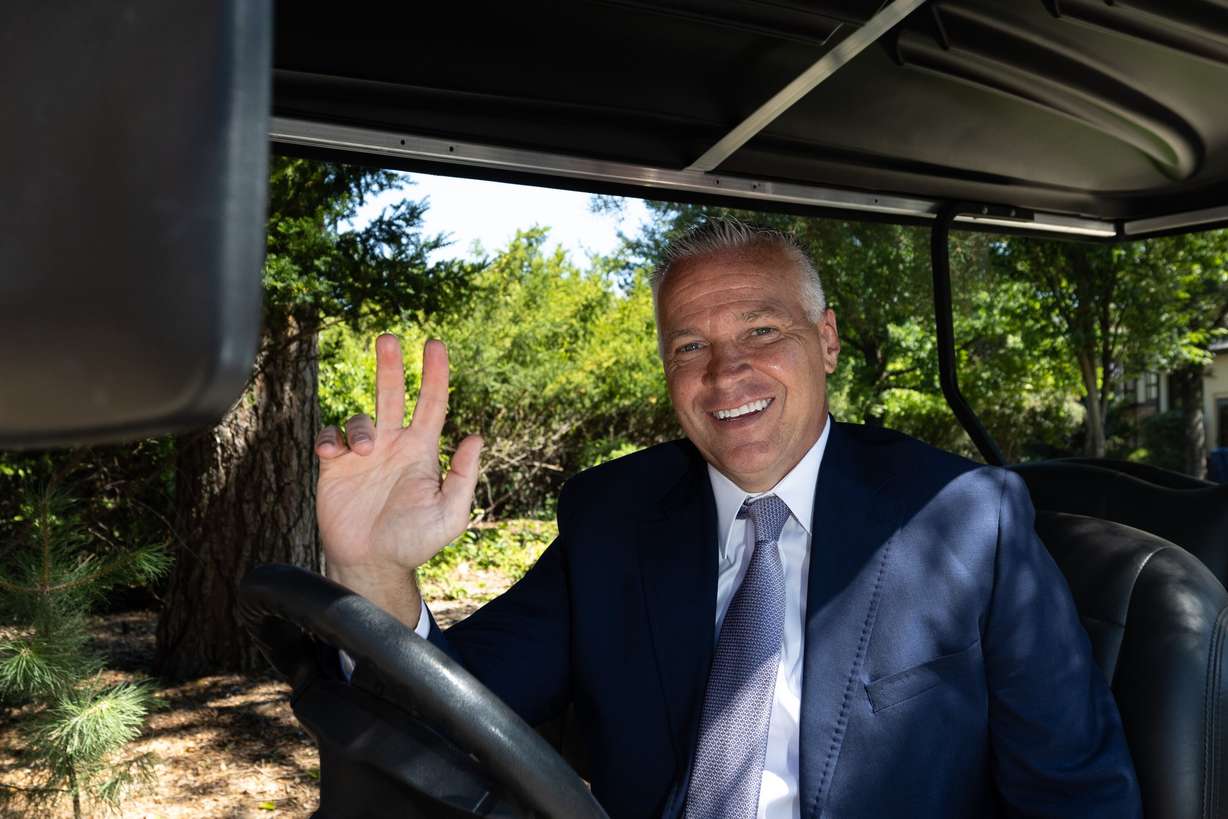 Brigham Young University President C. Shane Reese waves outside of the Former Presidents’ Home on campus in Provo on Monday. Reese has made it a point to foster connections in Mapleton by simply waving at others.