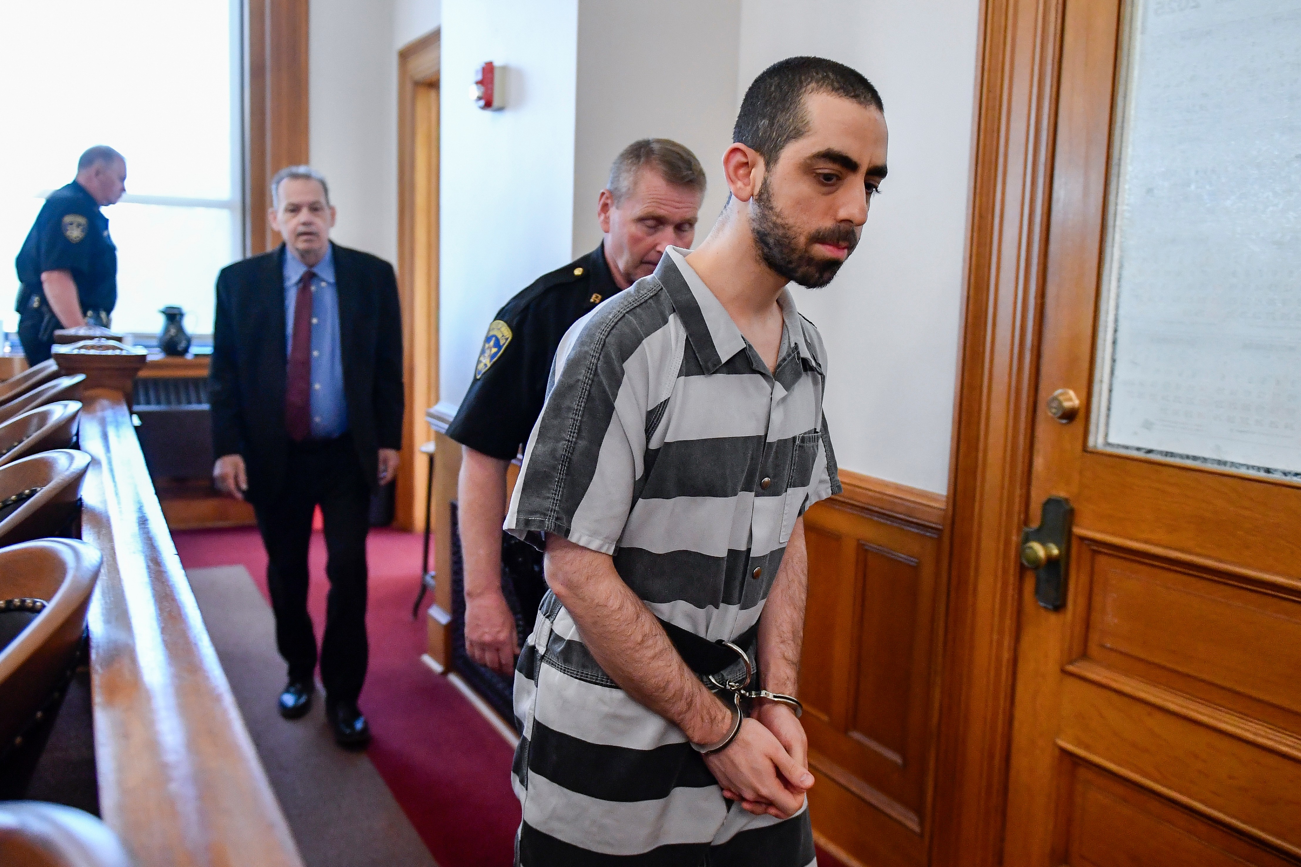 Hadi Matar walks in to the Chautauqua County court in Mayville, N.Y., May, 16, 2025. Matar's federal terrorism trial began on Wednesday.