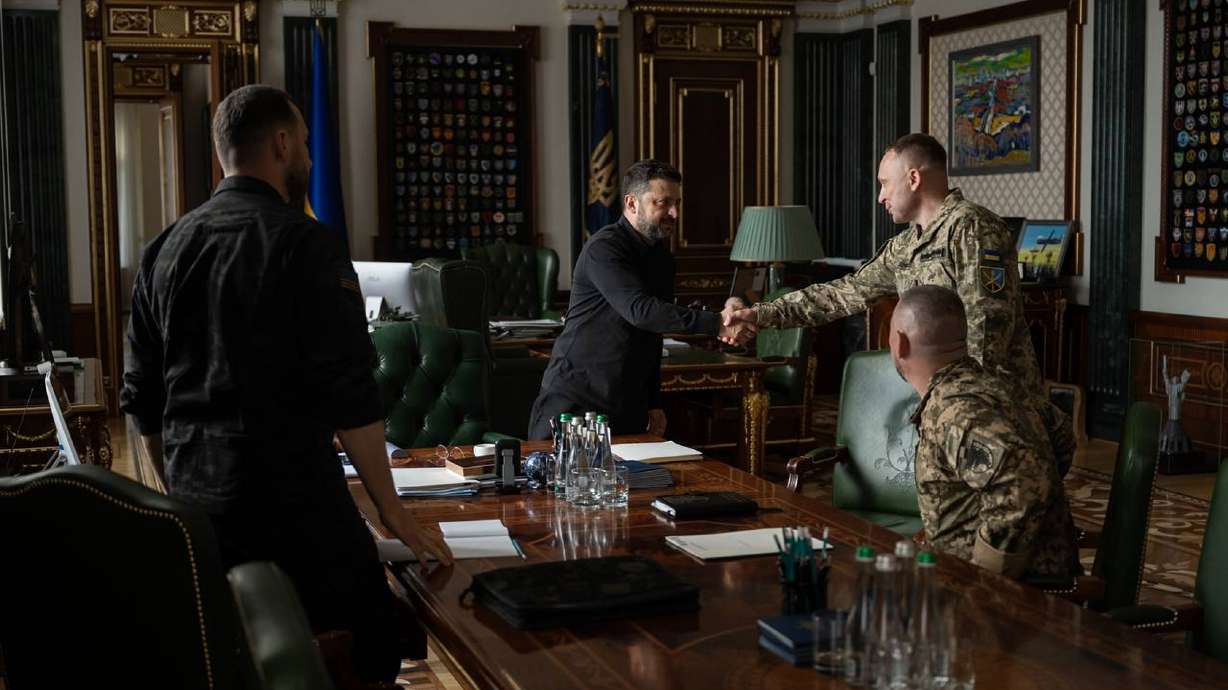 Ukrainian President Volodymyr Zelenskyy shakes hands with new Commander-in-Chief of Ukraine's Armed Forces Mykhailo Drapatyi during their meeting in Kyiv, Monday. Drapatyi replaced Oleksandr Syrskyi, who was fired on Tuesday.