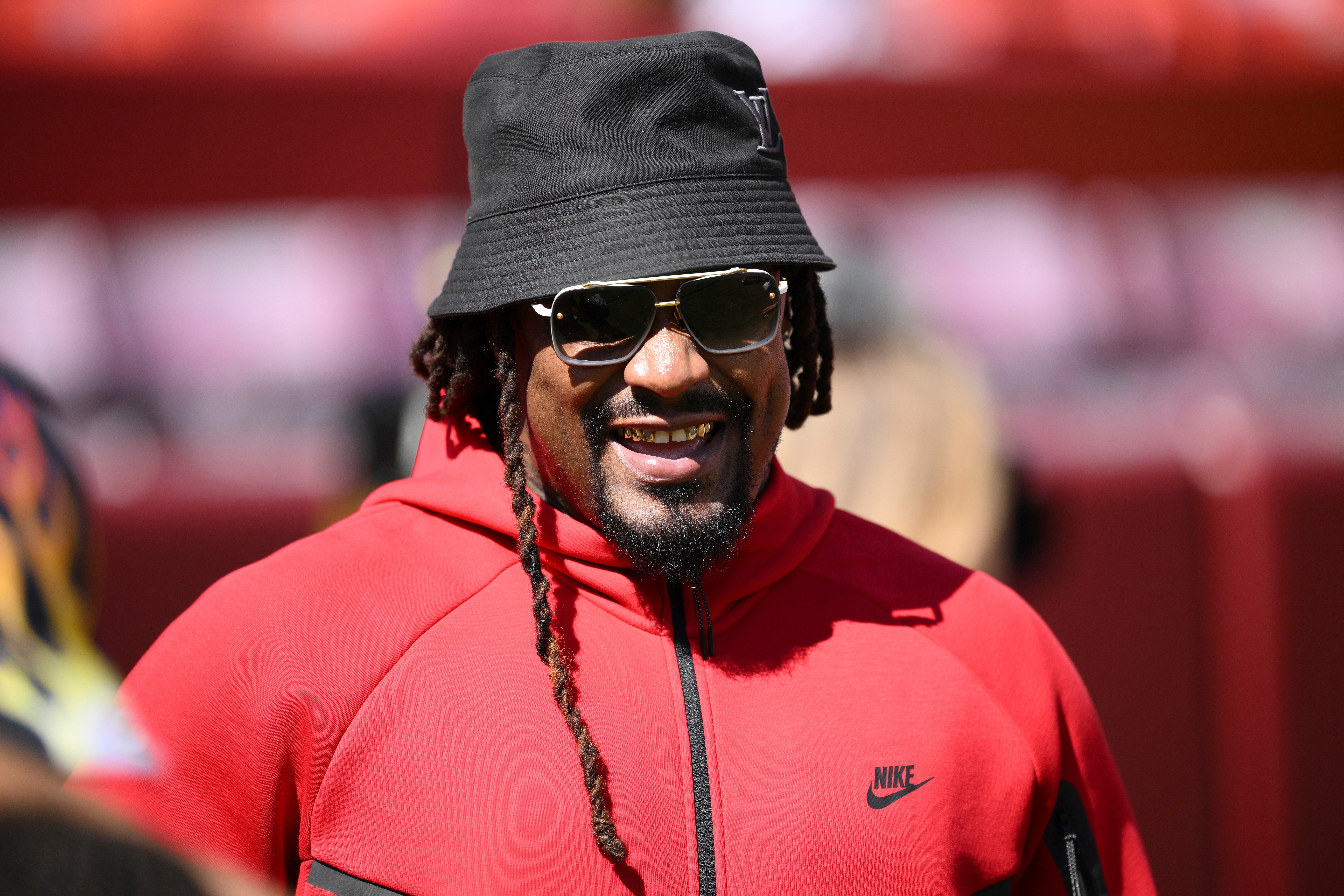 FILE - Marshawn Lynch looks on before an NFL preseason football game between the Washington Commanders and the Baltimore Ravens, Aug. 23, 2025, in Landover, Md. 