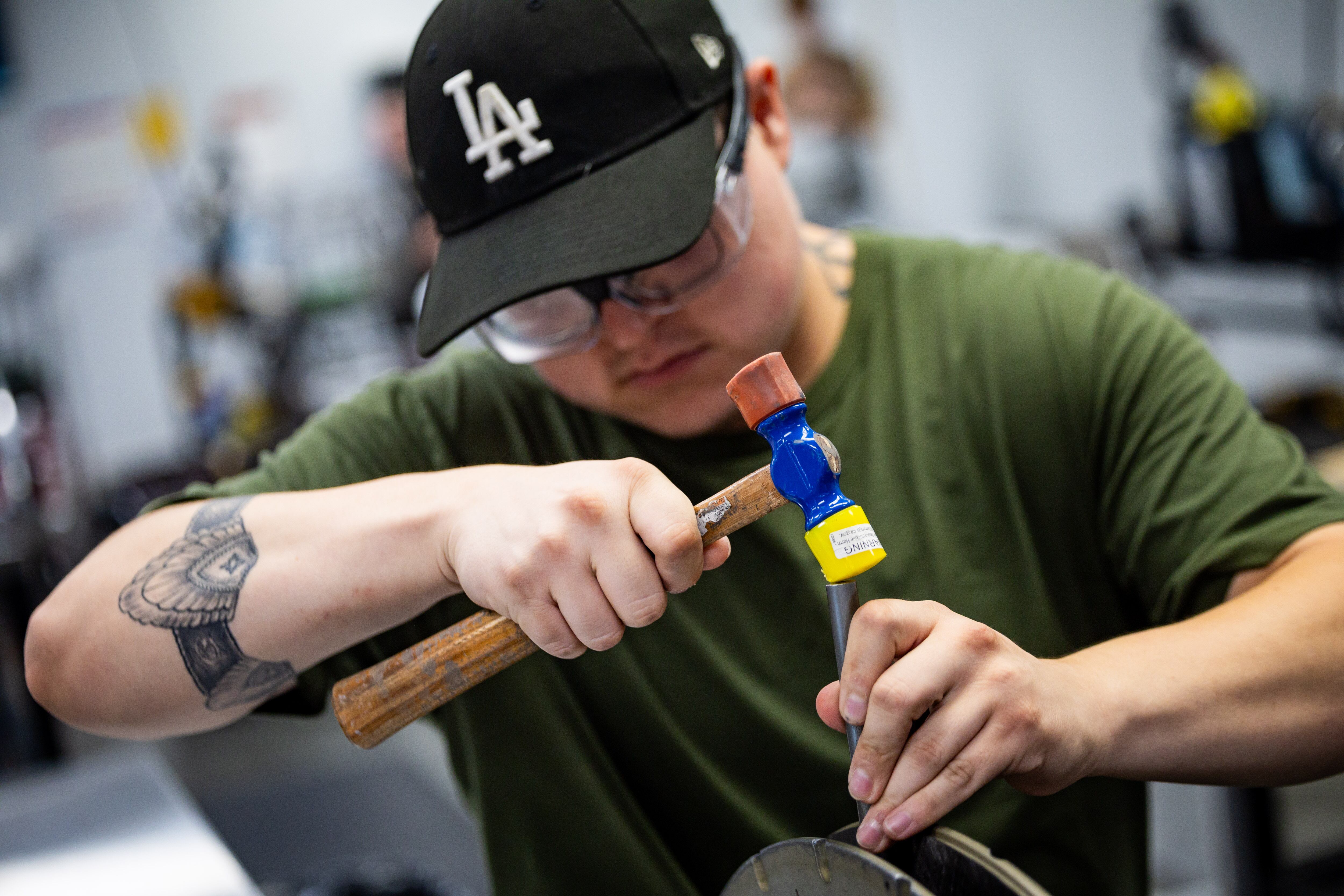 Lay up technician Alexander Velazquez works on putting the rim together at the ENVE Composites factory in Ogden on July 17.