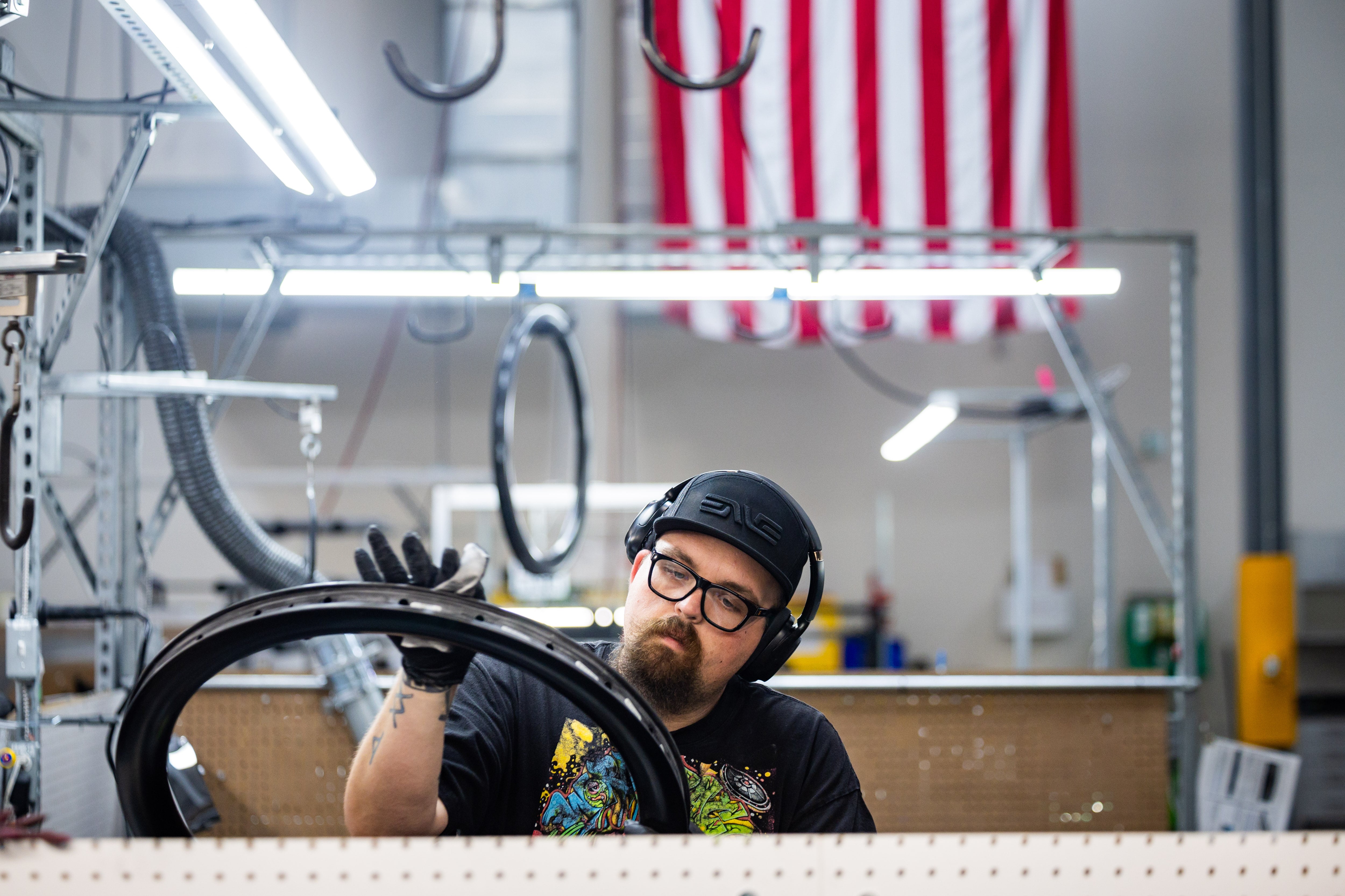James Gardner, quality control technician 2, checks for scuffs and blemishes on the rim at the ENVE Composites factory in Ogden on July 17.