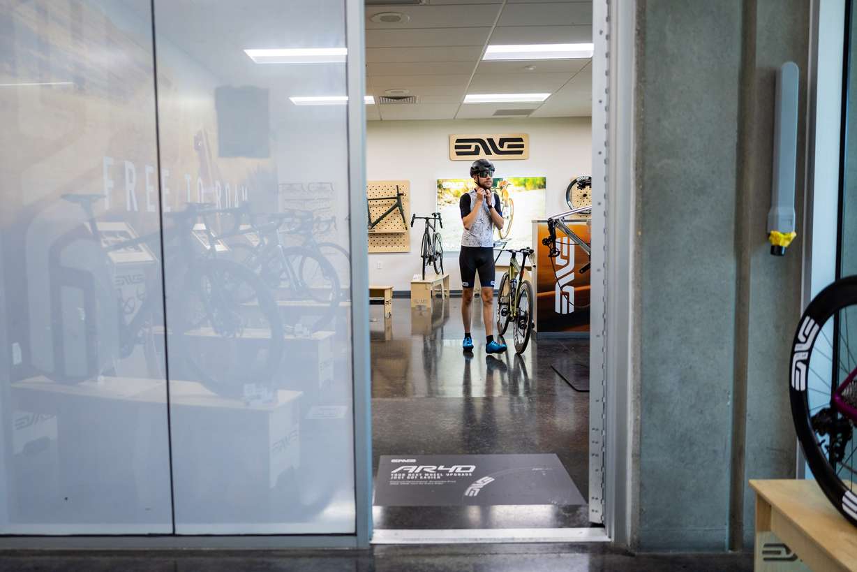 Tryston Klein, material handling employee, prepares to go on a bike ride on his hour-long lunch break at the ENVE Composites factory in Ogden on July 17.