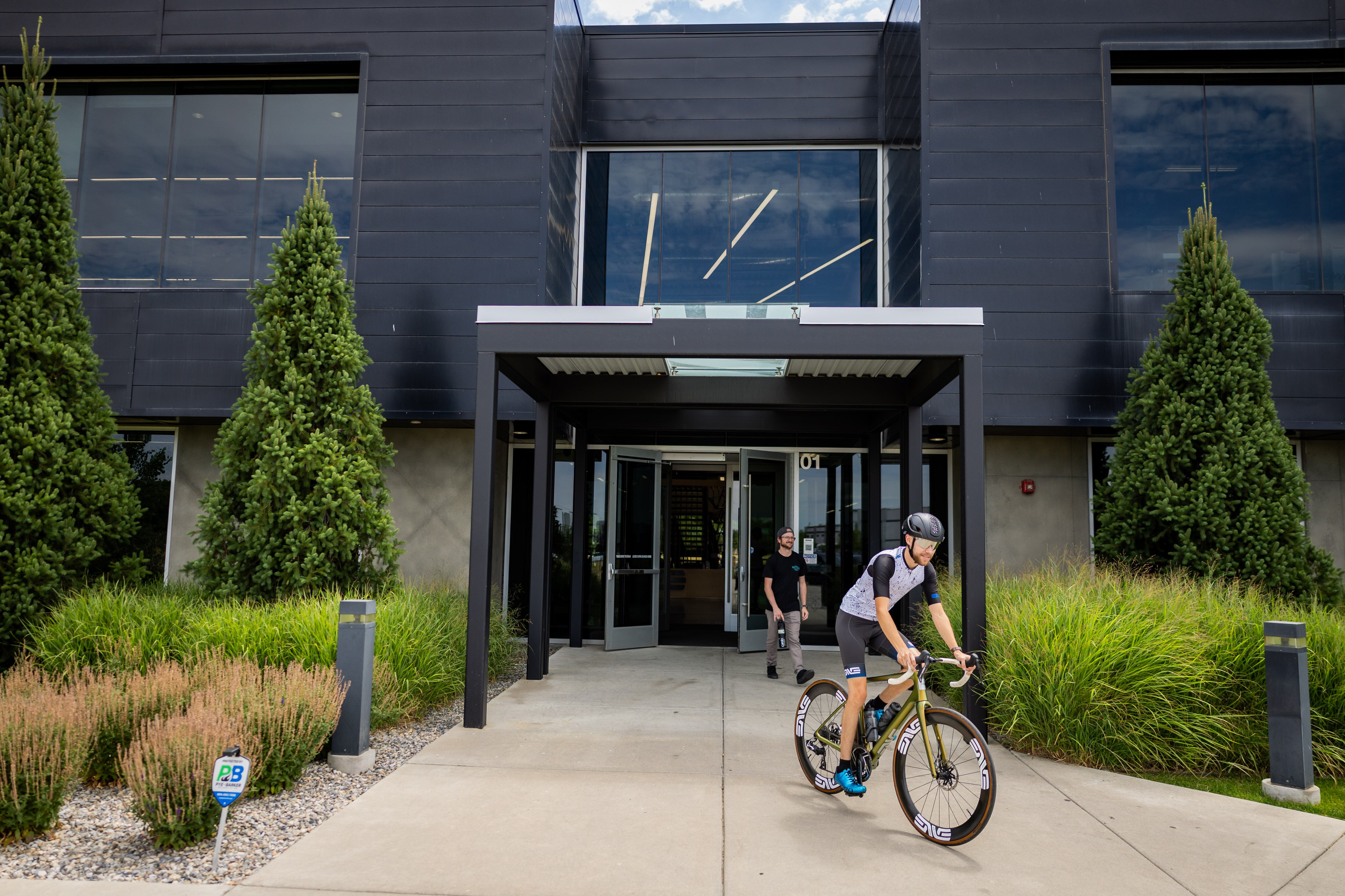 Tryston Klein, material handling employee, leaves on a bike ride on his hour-long lunch break at the ENVE Composites factory in Ogden on July 17.