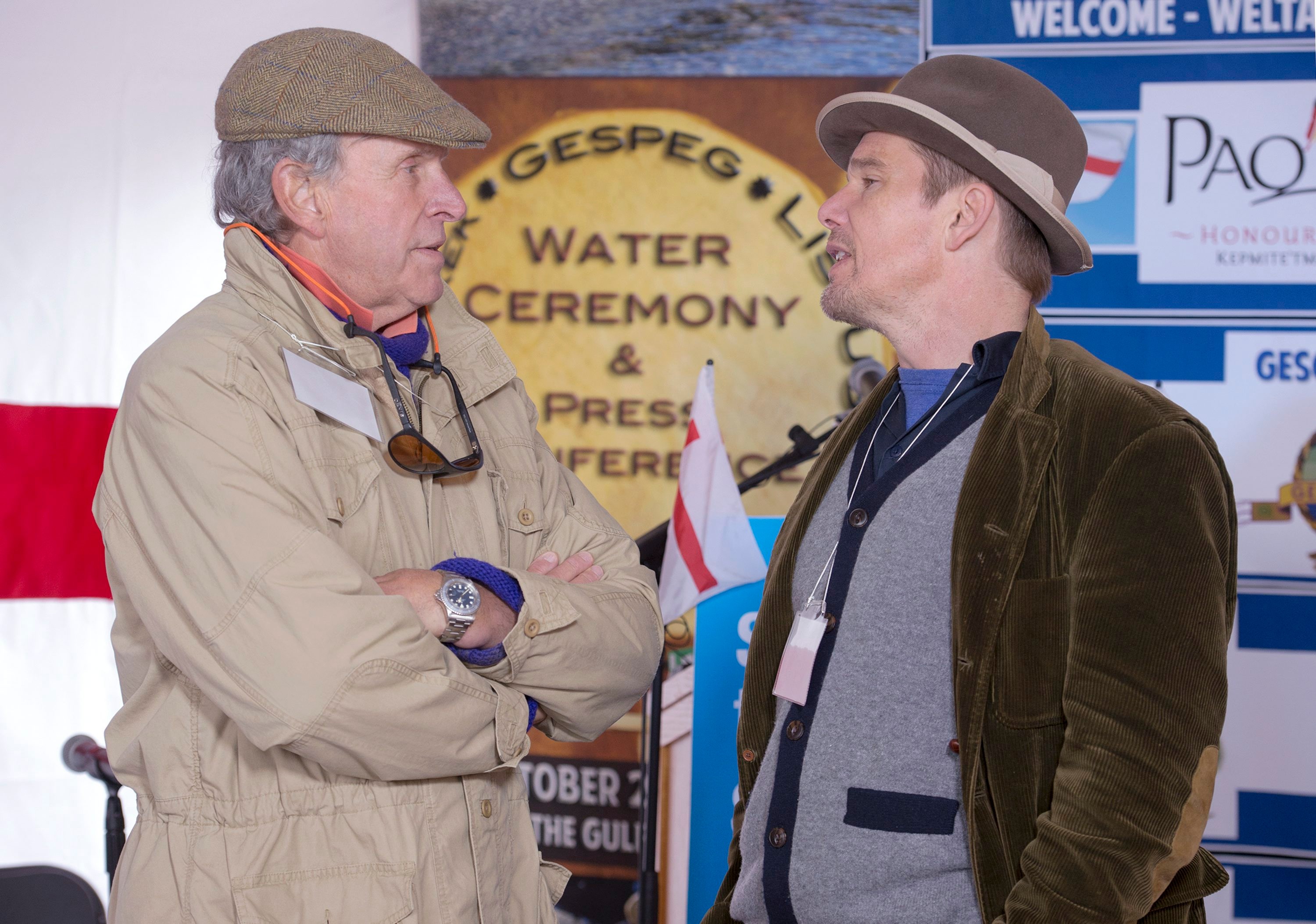 FILE - Actor Ethan Hawke, right, talks with Charles Gaines as they attend the Mi'kmaq community's water ceremony on the shores of Pomquet Harbour to support the aboriginal call for a moratorium on oil and gas exploration in the Gulf of St. Lawrence, near Antigonish, Nova Scotia, on Oct. 26, 2015. 