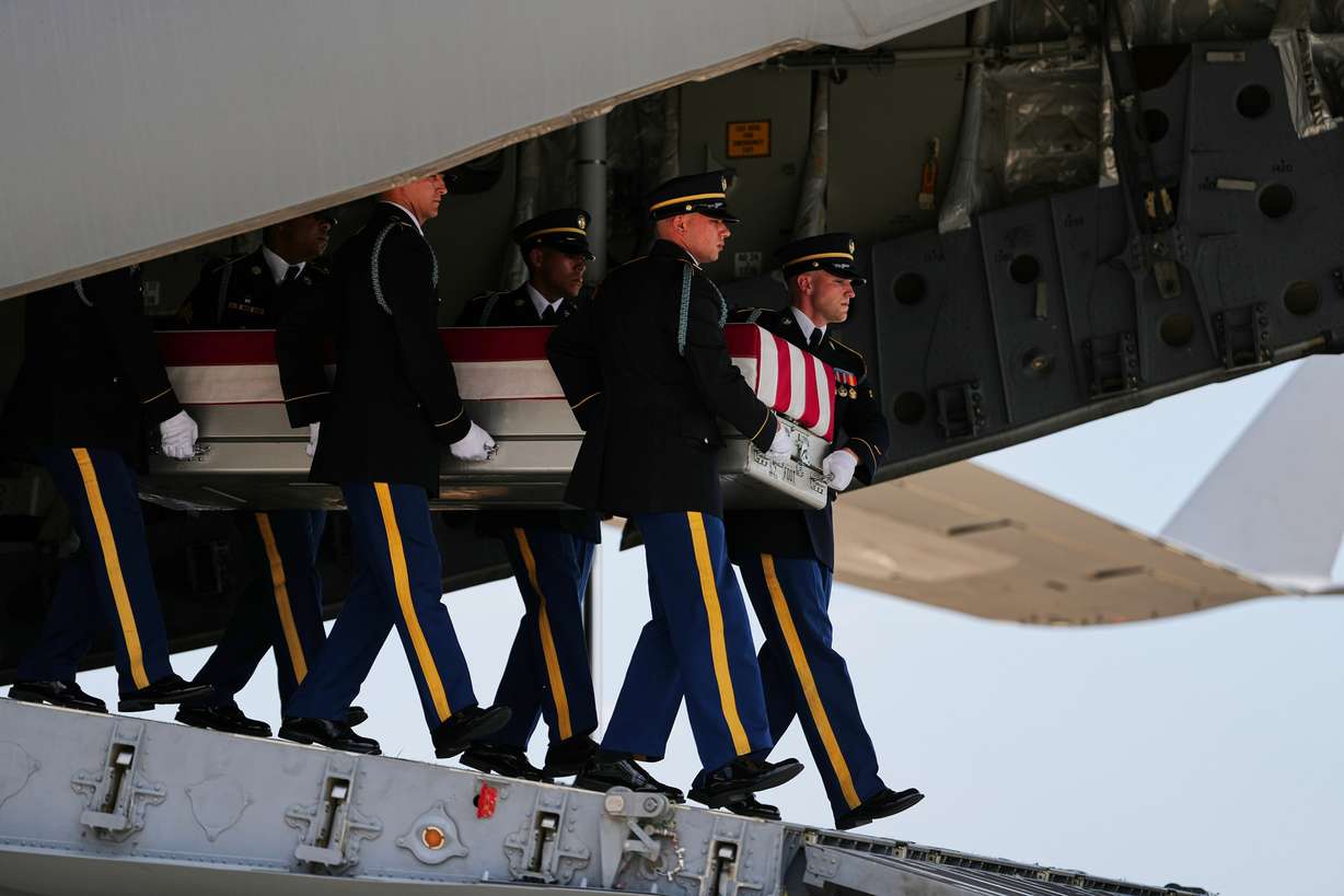 A U.S. Army carry team moves a transfer case containing the remains of 1st Lt. Tyler James Feehan of Ewa Beach, Hawaii, on Wednesday at Dover Air Force Base, Del.