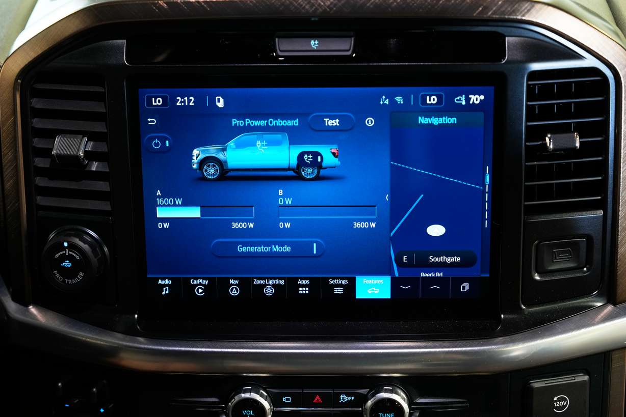 A Pro Power onboard information screen is displayed on a Ford F-150 King Ranch, Wednesday in Southgate, Mich. An available adapter makes the vehicle compatible to plug into a longer, separate cable that connects to a transfer switch installed directly on one's electric meter.