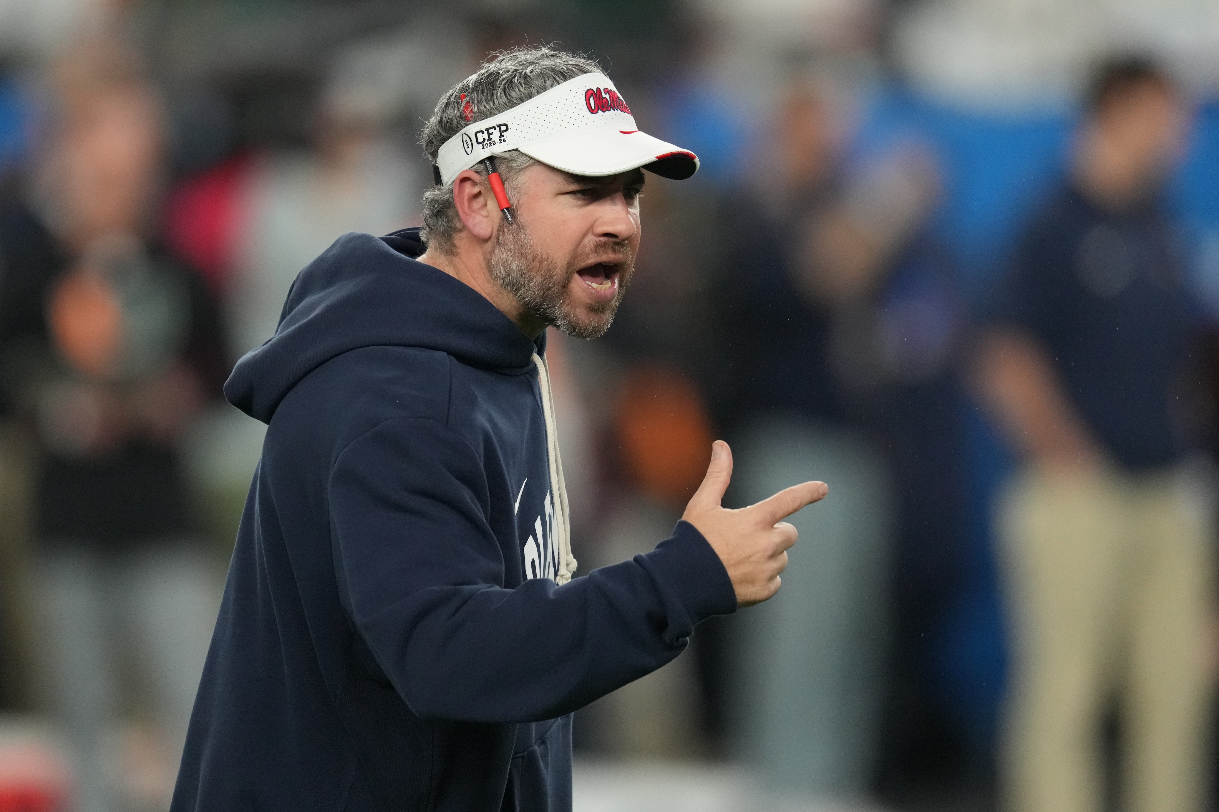 Mississippi head coach Pete Golding directs his players before the Fiesta Bowl NCAA college football playoff semifinal game against Miami, Thursday, Jan. 8, 2026, in Glendale, Ariz. 