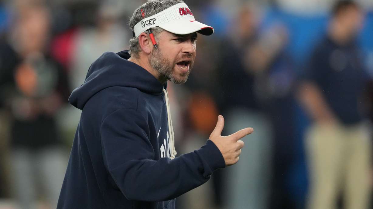 Mississippi head coach Pete Golding directs his players before the Fiesta Bowl NCAA college football playoff semifinal game against Miami, Thursday, Jan. 8, 2026, in Glendale, Ariz.