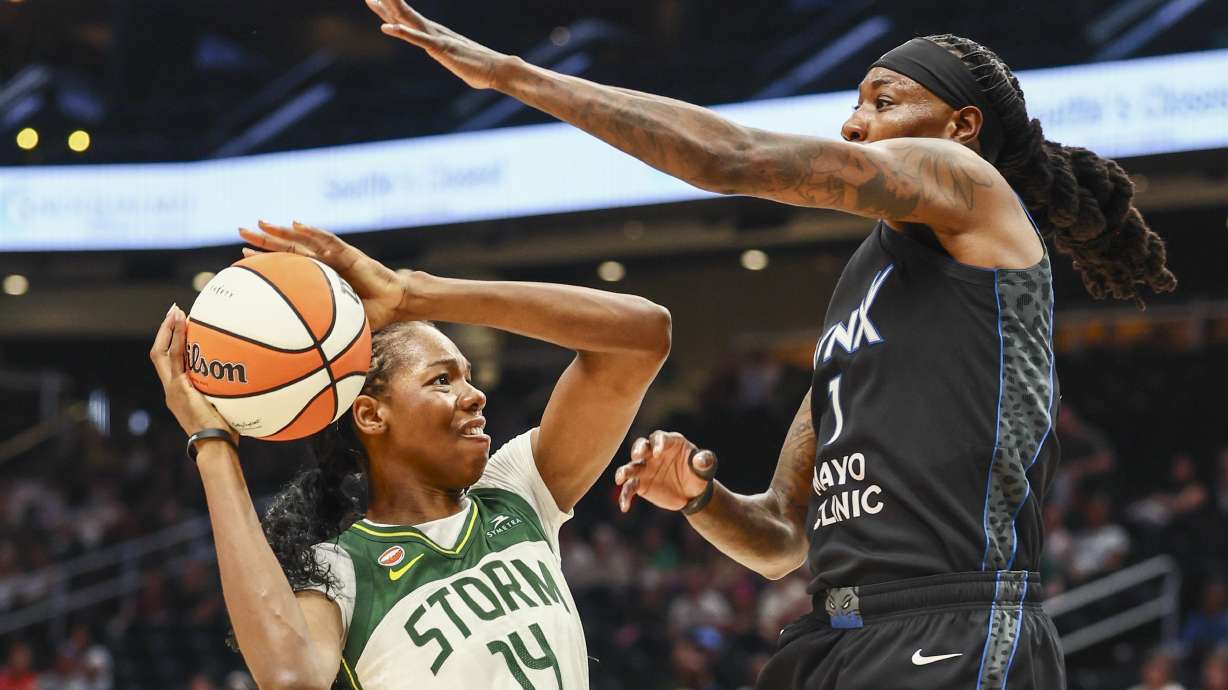 Seattle Storm center Dominique Malonga (14) looks to shoot as Minnesota Lynx forward Natasha Howard defends during a WNBA basketball game, Wednesday afternoon, July 22, 2026, in Seattle.