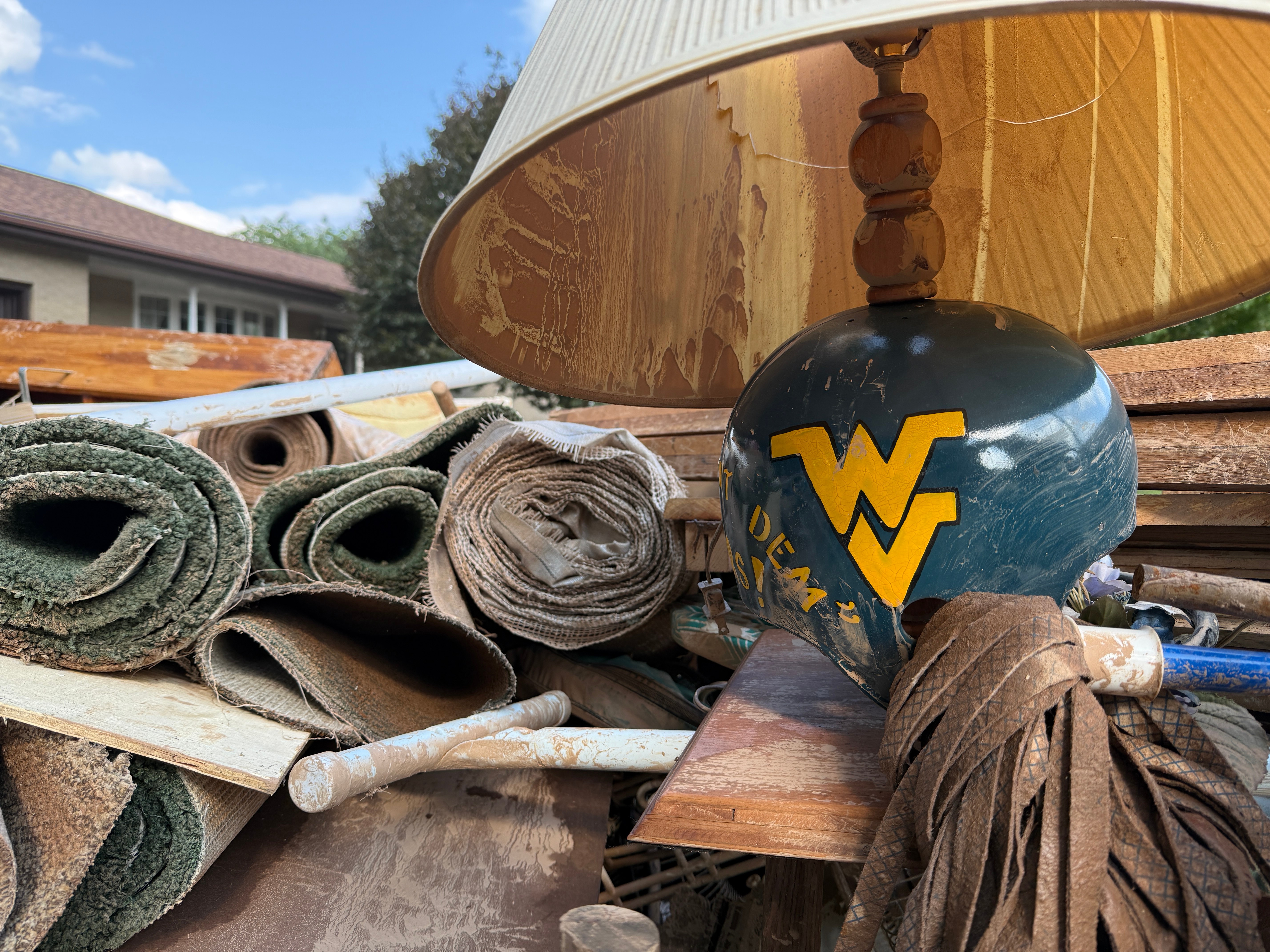 Damage and debris outside of a home after severe floods in Weston, W.Va., on Wednesday.