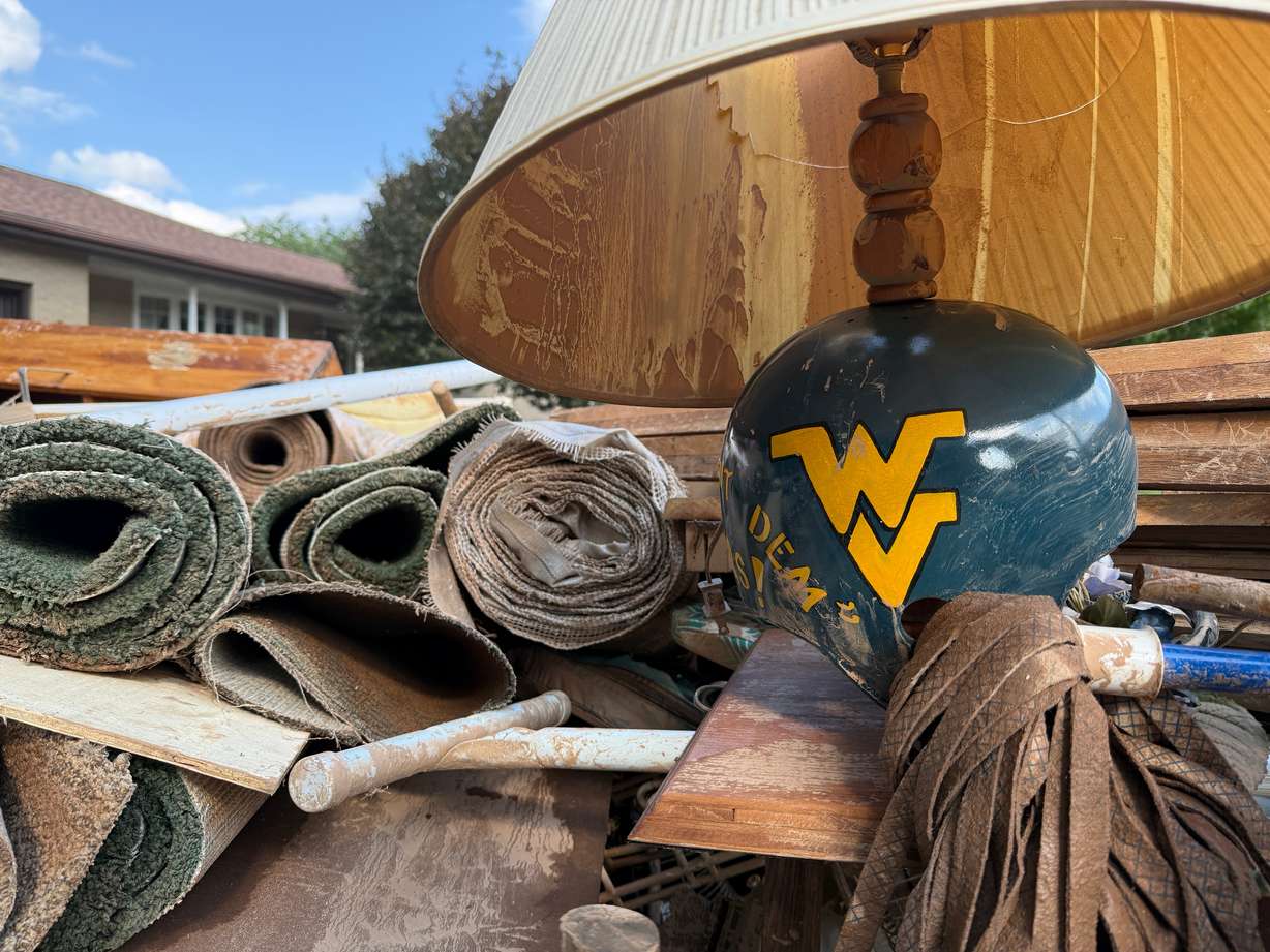 Damage and debris outside of a home after severe floods in Weston, W.Va., on Wednesday.