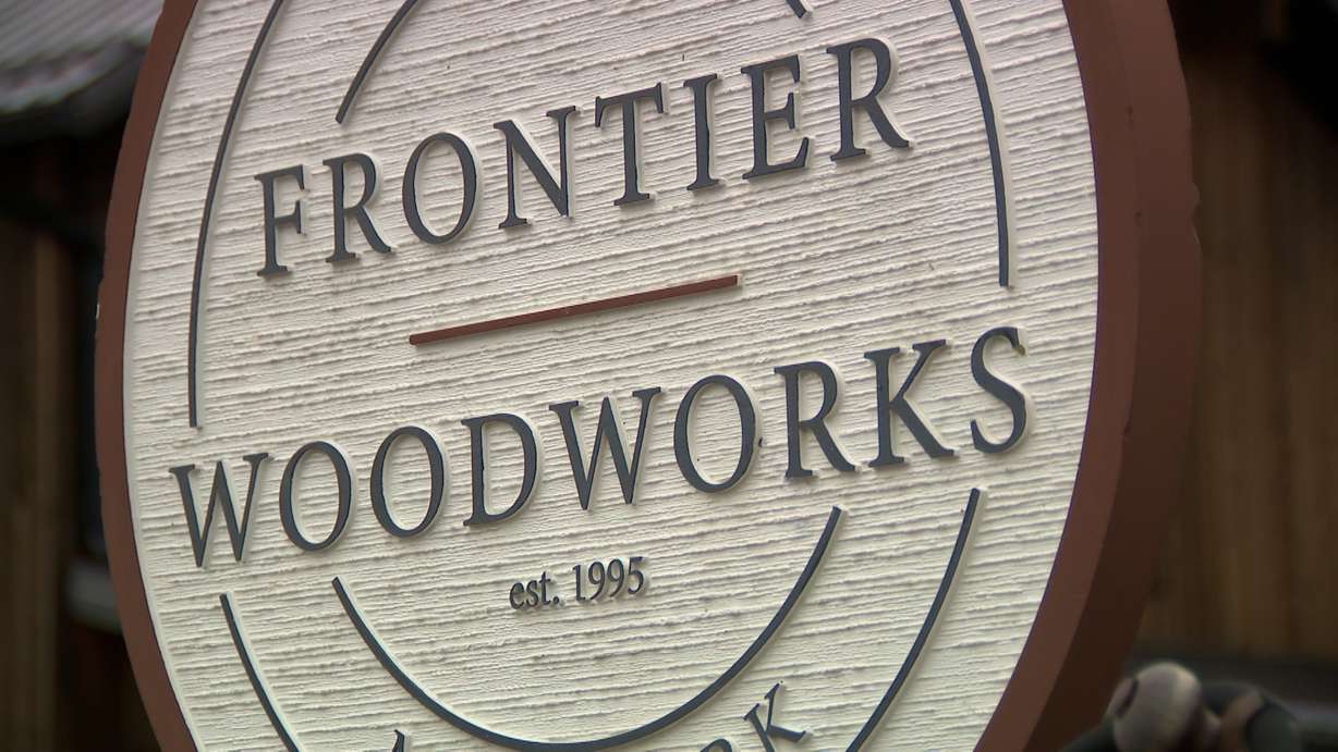 The Frontier Woodworks sign is pictured on Wednesday.