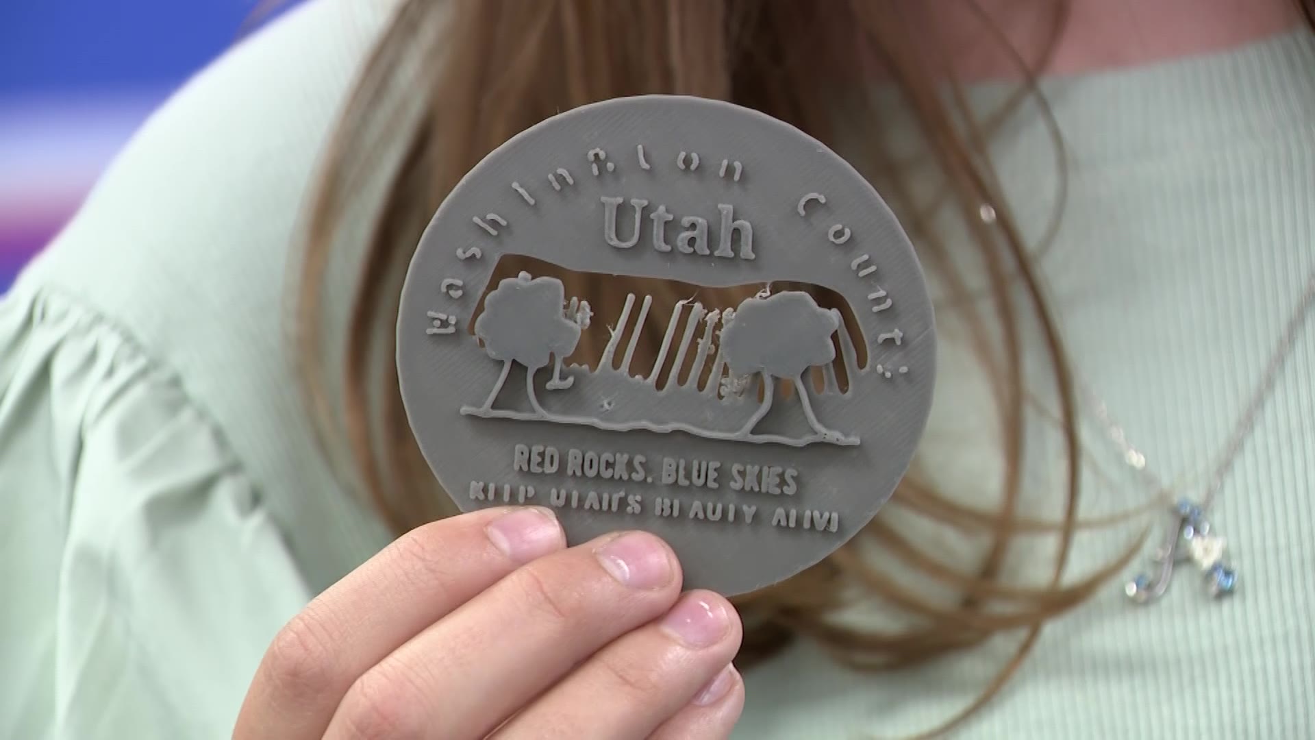 Aly Bowes' 3D-printed coin that she designed for the Utah 3D Coin Design Contest is pictured on Wednesday, July 22, 2026.