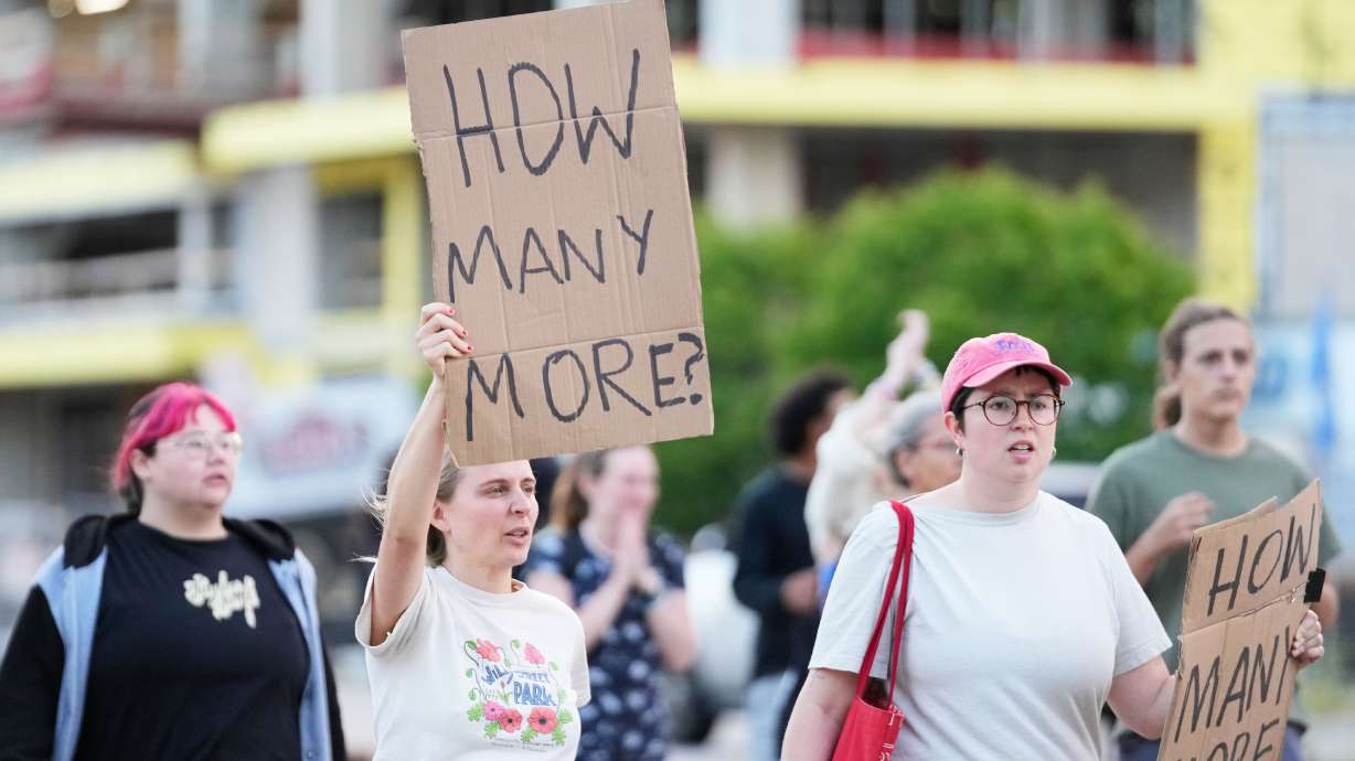 Protesters march after a Madison police officer shot and killed a man Wednesday, in Madison, Wis. The shooting death has roiled Madison and prompted Gov. Tony Evers to call for transparency and accountability in any investigation.