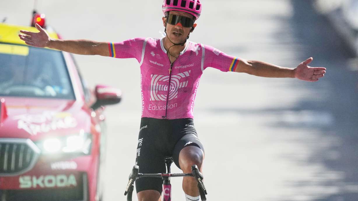 Ecuador's Richard Carapaz celebrates as he crosses the finish line to win the eighteenth stage of the Tour de France cycling race, with start in Voiron and finish in Orcieres-Merlette, France, Thursday, July 23, 2026.