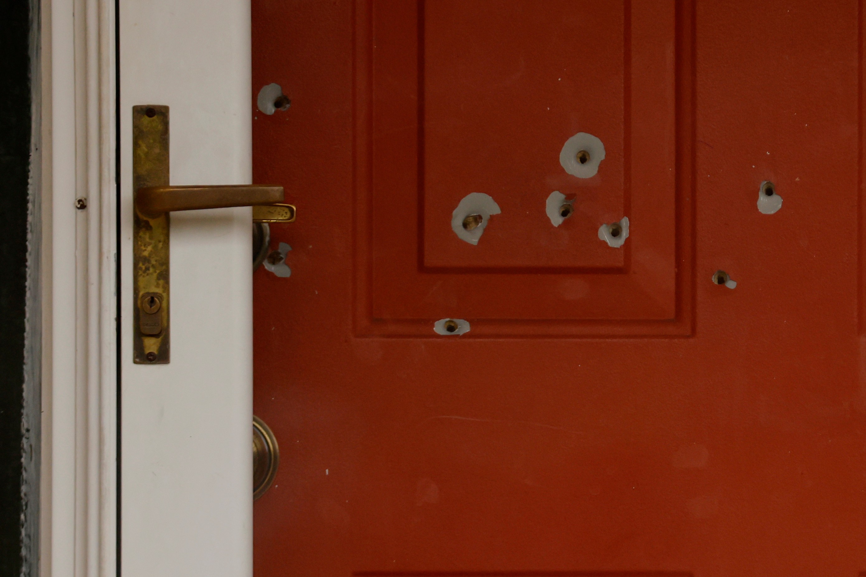 Bullet holes mark the front door of the house of tate Sen. John Hoffman and his wife who were shot earlier in the day on June 14, 2025, in Champlin, Minn. Yvette Hoffman said on Thursday at the sentencing for Vance Boelter that she sees a therapist weekly.