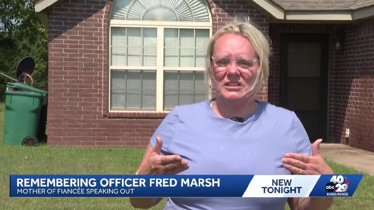 An Arkansas police officer proposed to his girlfriend hours before he died while trying to save her from drowning, according to the woman's mother.