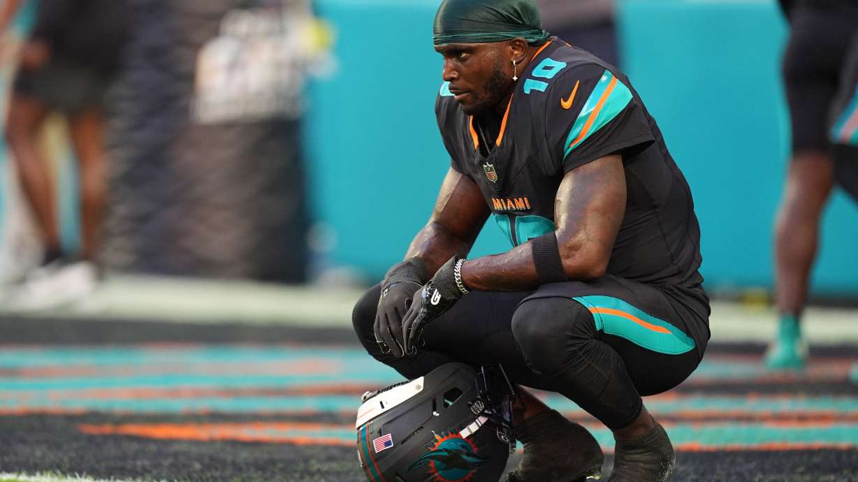 FILE - Miami Dolphins wide receiver Tyreek Hill sits in the end zone before an NFL football game against the New York Jets, Sept. 29, 2025, in Miami Gardens, Fla.
