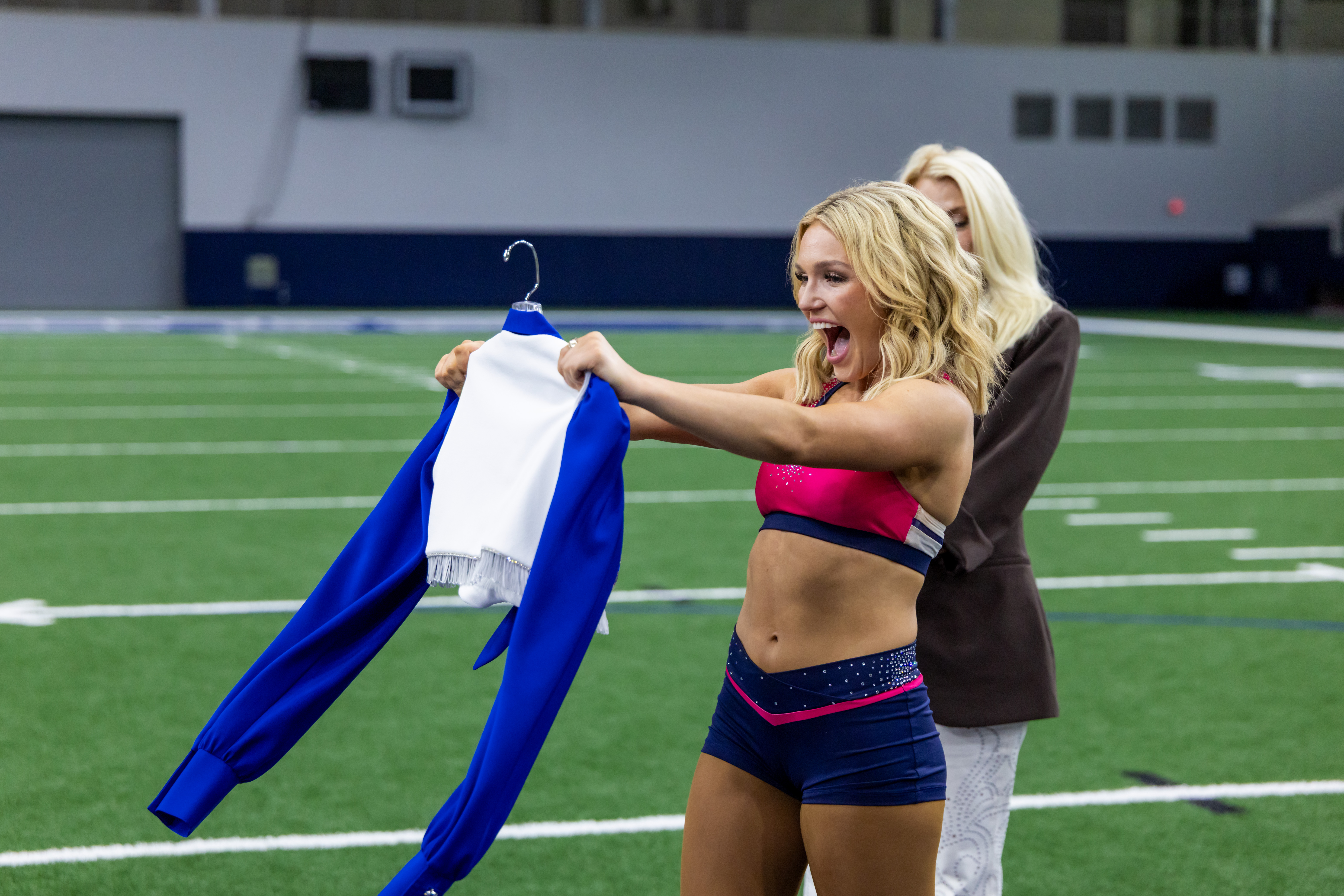 Savanna Dastrup receives her uniform after making the 2026-2027 team of the Dallas Cowboys Cheerleaders.