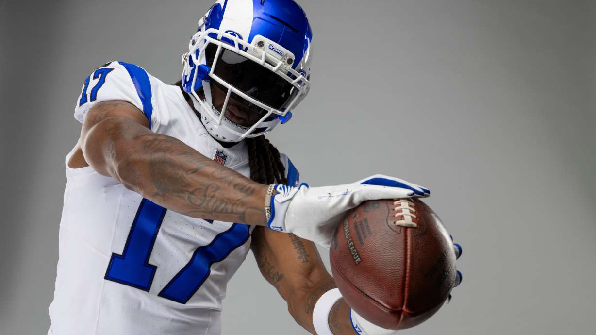 This undated photo provided by the Los Angeles Rams, Thursday, July 23, 2026, shows wide receiver Davante Adams posing in Los Angeles while wearing the Rams’ new “Fearsome White” alternate uniform.