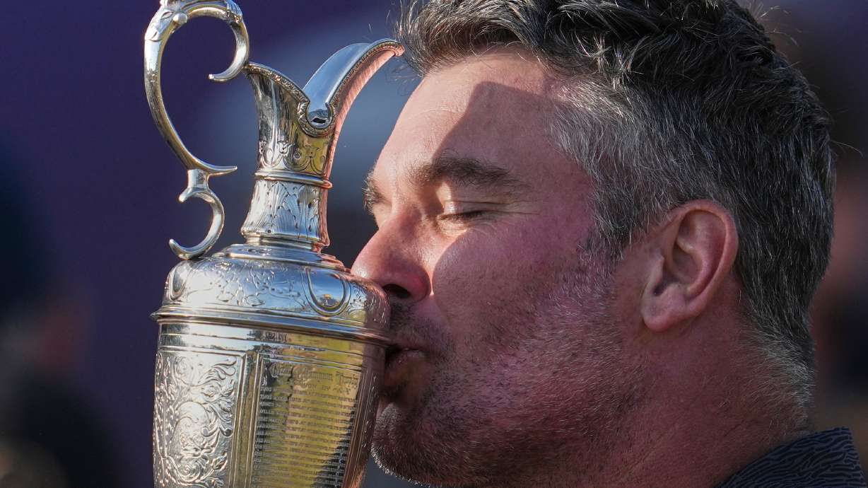 Ryan Fox of New Zealand kisses the Claret Jug trophy after winning the British Open Golf championships at Royal Birkdale golf club, in Southport, England, Sunday, July 19, 2026.