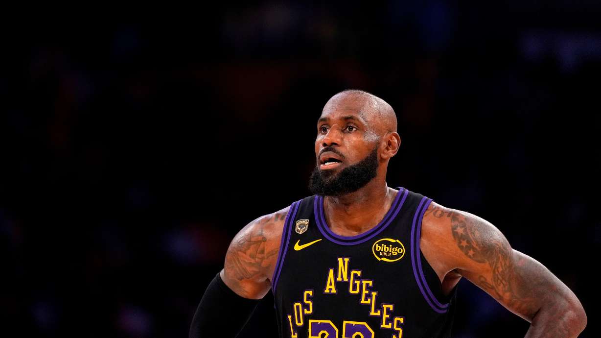 Los Angeles Lakers forward LeBron James stands on the court in the closing minutes of Game 4 in a second-round NBA basketball playoffs series against the Oklahoma City Thunder, May 11, 2026, in Los Angeles. James announced he is heading to the Philadelphia 76ers.