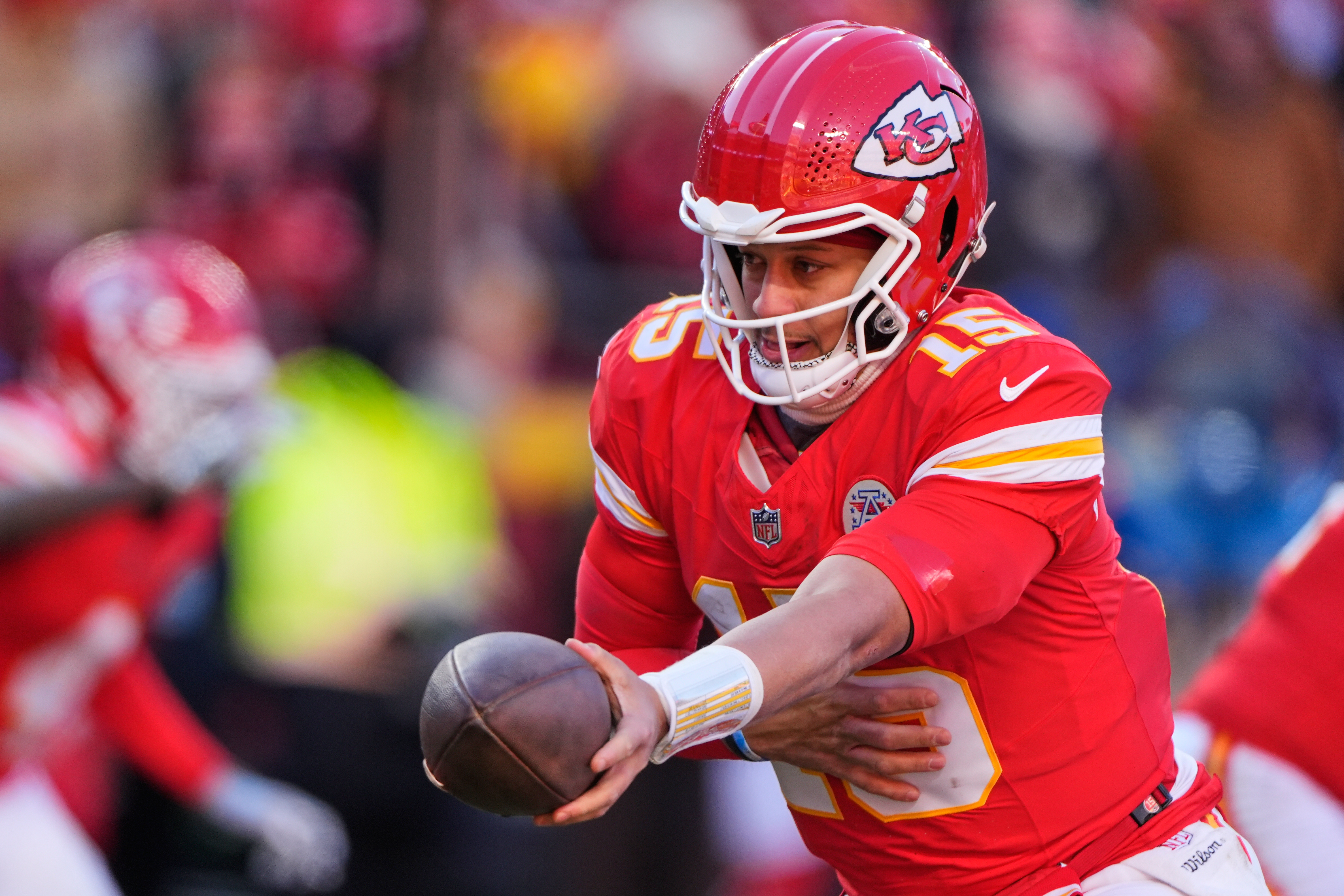 FILE - Kansas City Chiefs quarterback Patrick Mahomes hands off the ball during the second half of an NFL football game against the Los Angeles Chargers, Dec. 14, 2025, in Kansas City, Mo. 
