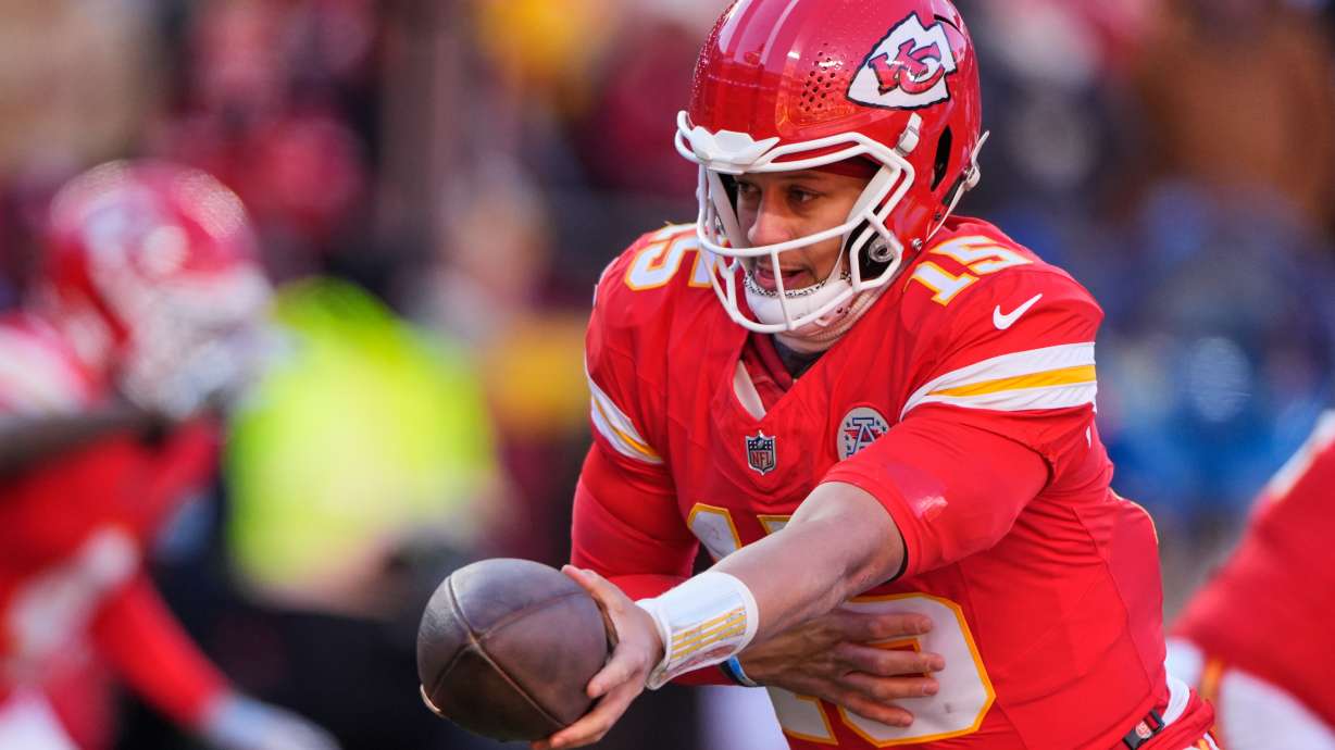 FILE - Kansas City Chiefs quarterback Patrick Mahomes hands off the ball during the second half of an NFL football game against the Los Angeles Chargers, Dec. 14, 2025, in Kansas City, Mo.