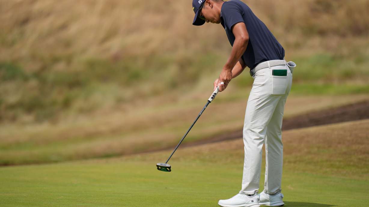 Michael Kim of the United States putts on the 3rd green during the second day of the British Open Golf championships at Royal Birkdale golf club, in Southport, England, Friday, July 17, 2026.